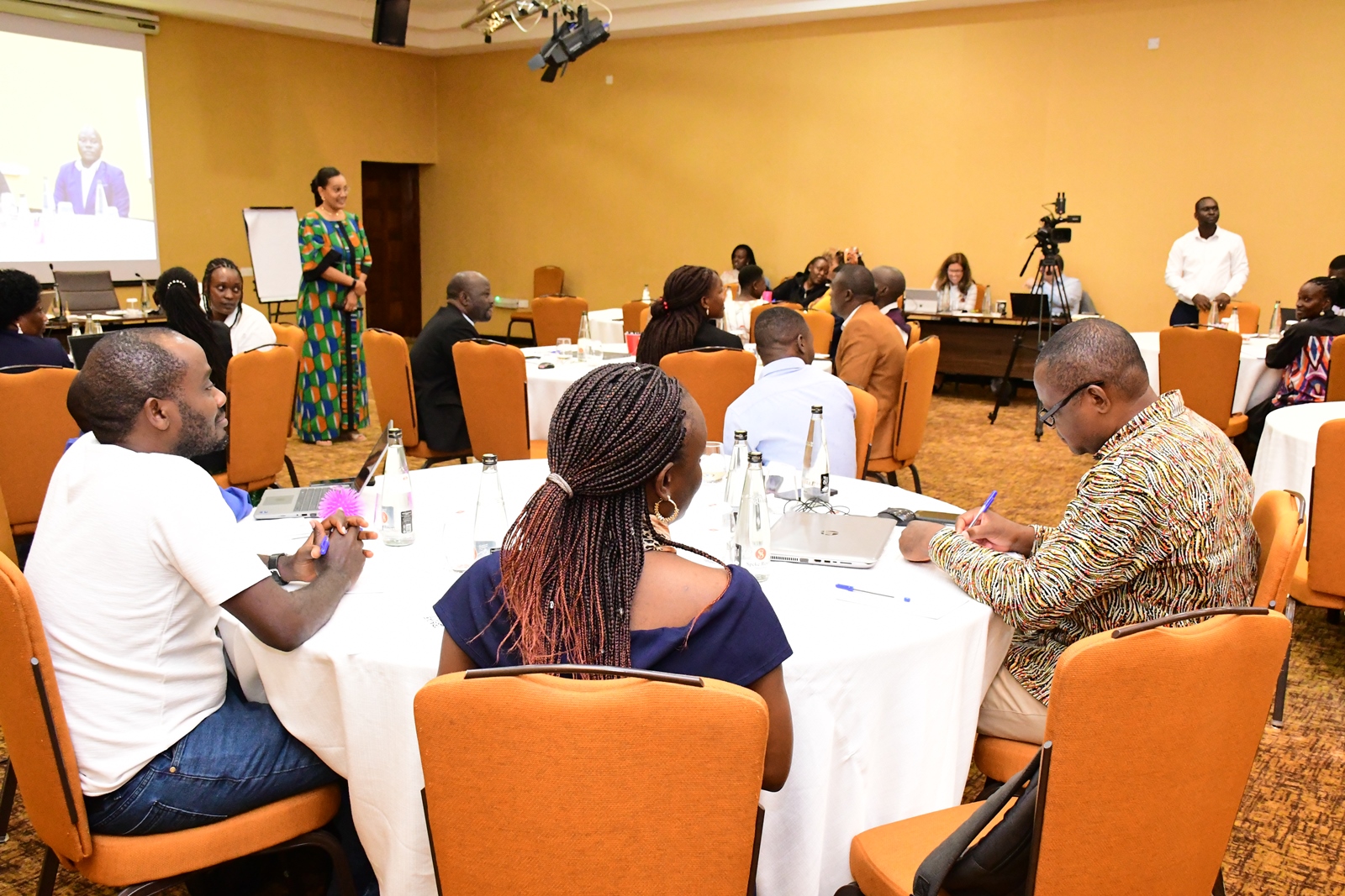 Facilitator Lara Rabala (standing) with participants. Institute of Open, Distance and e-Learning (IODeL), College of Education and External Studies (CEES) disseminating results of phase 1 of the e-Learning initiative at Makerere University, Makerere University, Kampala Uganda, East Africa supported by Mastercard Foundation, Arizona State University (ASU)-USA, to over 75 participants and key stakeholders, 24th April 2025, Speke Resort Munyonyo.