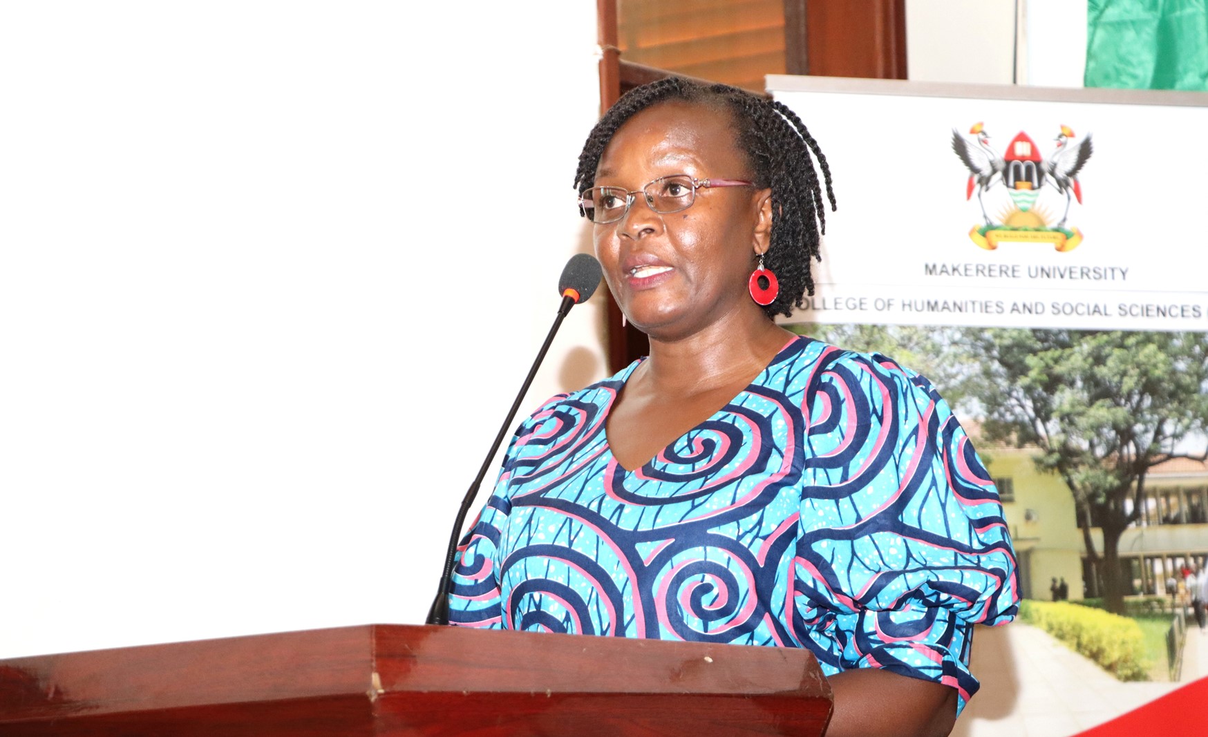 Dr. Pamela Khanakwa delivering her speech. College of Humanities and Social Sciences (CHUSS) a historic public dialogue between Dr. Jimmy Spire Ssentongo and Dr. Yahaya Hills Kagali Sekagya, titled “Traditional Spirituality, Herbal Medicine, Witchcraft and Questions of Truth.” 29th April 2025, College of Engineering, Design, Art and Technology (CEDAT) Conference Hall, Makerere University, Kampala Uganda, East Africa.