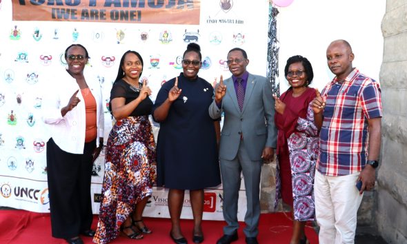 The MP, Dr. Cindy Magara, Prof. Helen N. Nkabala, Dr. Eve Nabukya and Dr. Levis Mugumya flash Tuko Pamoja symbol in a group photo. Department of Literature, School of Languages, Literature and Communication, College of Humanities and Social Sciences (CHUSS) screening of Tuko Pamoja, a documentary by Dr. Cindy Magara, Nyati Motion Pictures, 13th May 2025, Main Hall, Makerere University, Kamapala Uganda, East Africa.