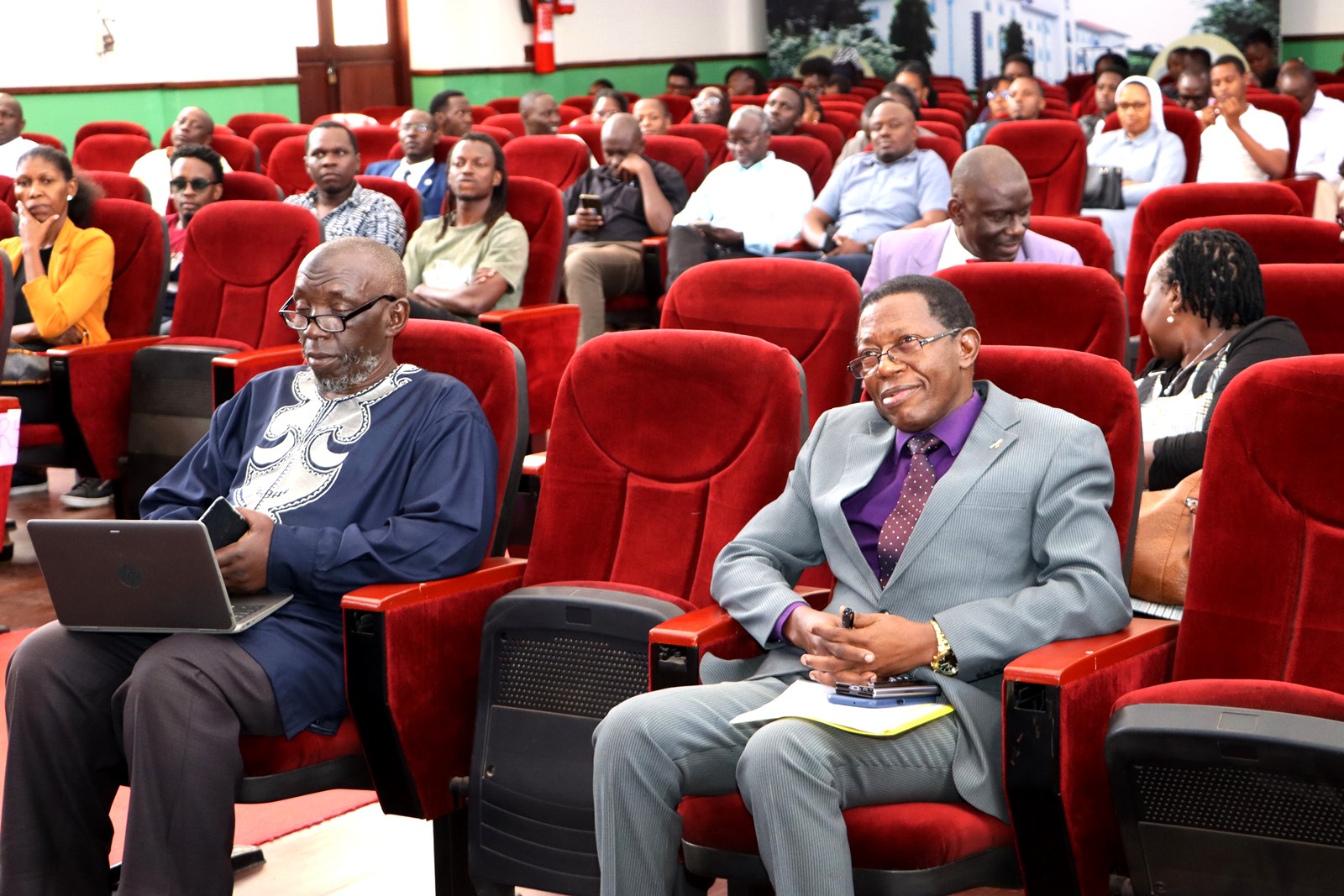 Prof. Mukadasi Buyinza watching the film. Department of Literature, School of Languages, Literature and Communication, College of Humanities and Social Sciences (CHUSS) screening of Tuko Pamoja, a documentary by Dr. Cindy Magara, Nyati Motion Pictures, 13th May 2025, Main Hall, Makerere University, Kamapala Uganda, East Africa.