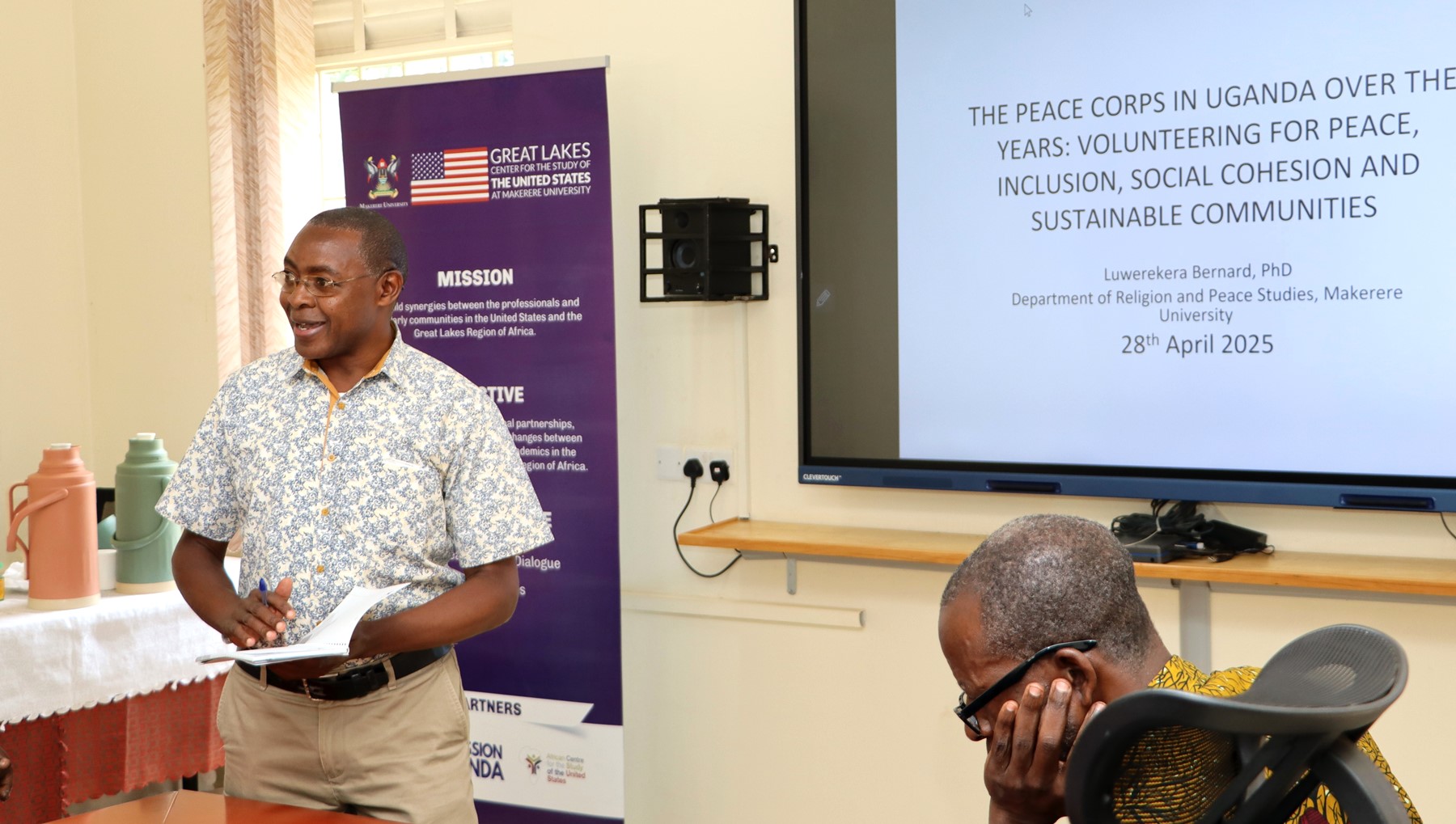 Dr. Luwerekera Bernard presenting on Peace Corps initiatives. The Centre for United States Studies at Makerere University held its first research review workshop, marking the beginning of an ambitious academic project to publish a book examining the historical and contemporary relations between the United States and Uganda, 28th April 2025, Kampala, East Africa.