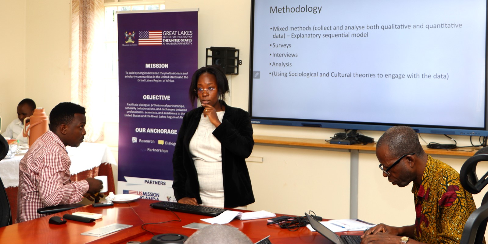 Itah Mbethki presenting on US education and cultural influence. The Centre for United States Studies at Makerere University held its first research review workshop, marking the beginning of an ambitious academic project to publish a book examining the historical and contemporary relations between the United States and Uganda, 28th April 2025, Kampala, East Africa.