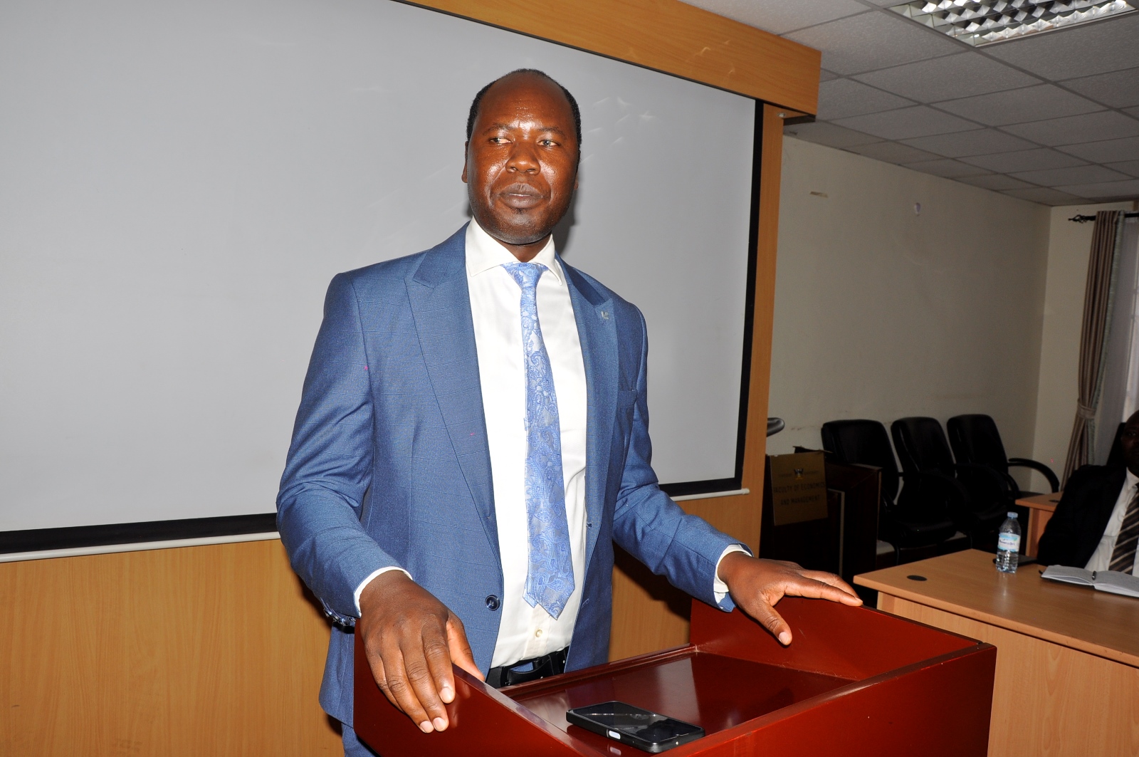 Brother Ambrose Kilama. Church of Jesus Christ of Latter-day Saints handed over 40 high-tech laptops and 10 projectors to Makerere University to facilitate teaching, learning, and research at the School of Business under the College of Business and Management Sciences (CoBAMS), 5th May 2025, Kampala Uganda, East Africa.