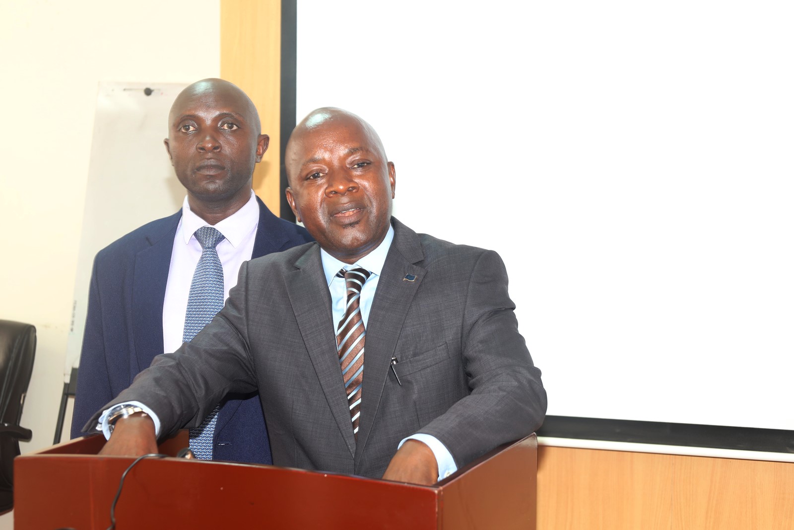 Dr. Mugarura and Dr. Tibaingana. Church of Jesus Christ of Latter-day Saints handed over 40 high-tech laptops and 10 projectors to Makerere University to facilitate teaching, learning, and research at the School of Business under the College of Business and Management Sciences (CoBAMS), 5th May 2025, Kampala Uganda, East Africa.