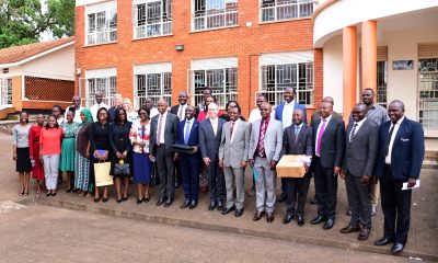 Dignitaries pose for a group photo with some of the ICT equipment on 5th May 2025. Church of Jesus Christ of Latter-day Saints handed over 40 high-tech laptops and 10 projectors to Makerere University to facilitate teaching, learning, and research at the School of Business under the College of Business and Management Sciences (CoBAMS), 5th May 2025, Kampala Uganda, East Africa.