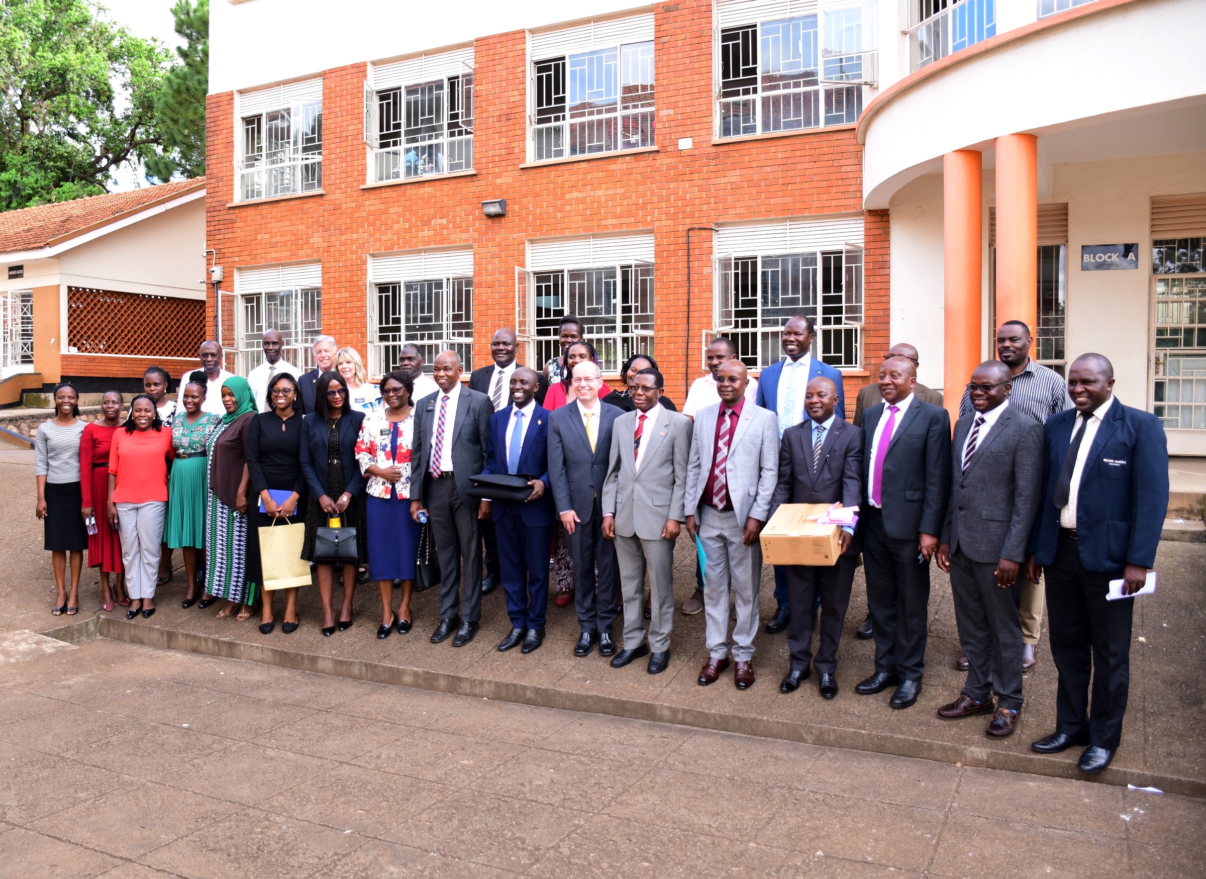 Dignitaries pose for a group photo with some of the ICT equipment on 5th May 2025. Church of Jesus Christ of Latter-day Saints handed over 40 high-tech laptops and 10 projectors to Makerere University to facilitate teaching, learning, and research at the School of Business under the College of Business and Management Sciences (CoBAMS), 5th May 2025, Kampala Uganda, East Africa.