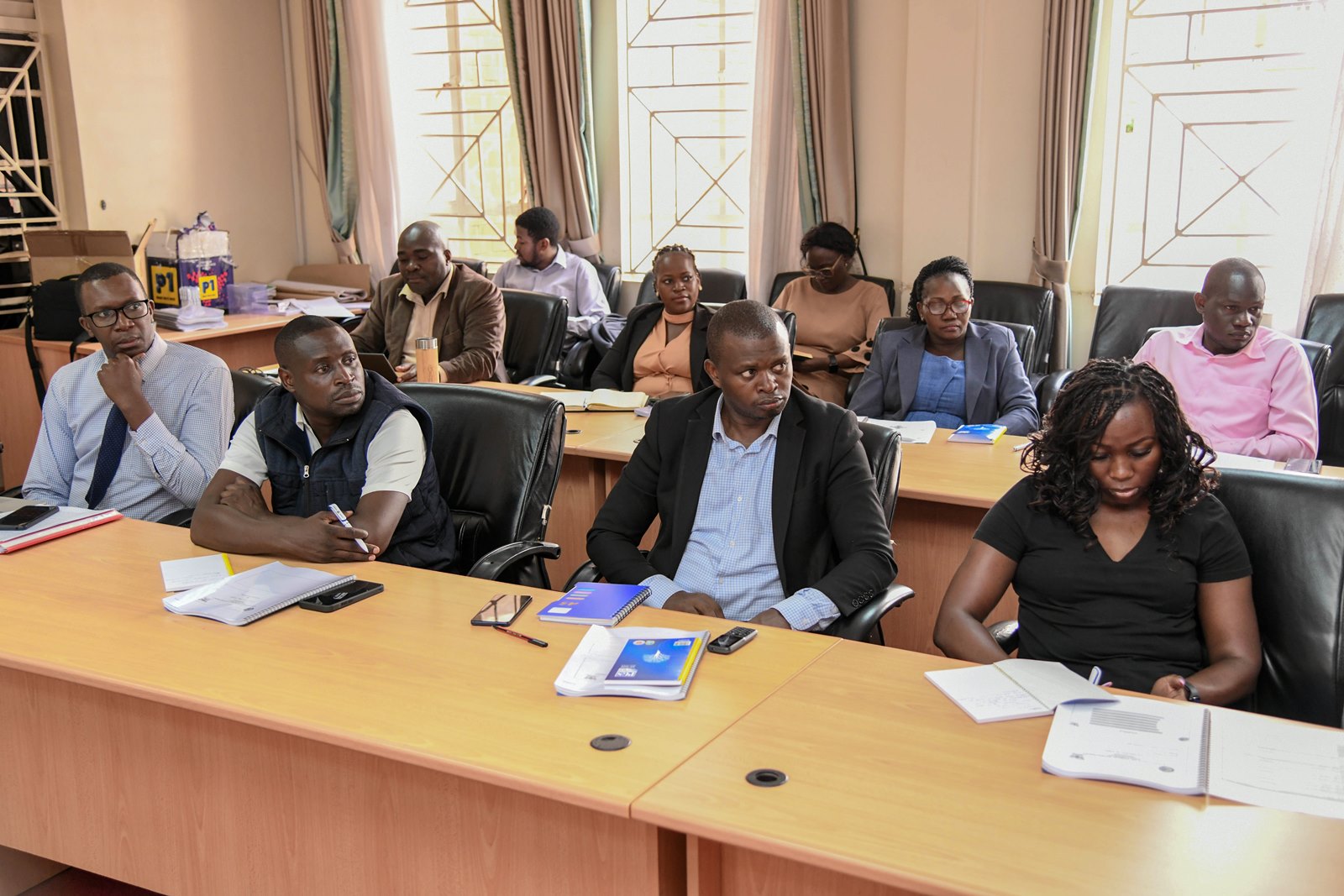 Participants follow proceedings at the launch. Public Investment Management Centre of Excellence (PIM CoE), College of Business and Management Sciences (CoBAMS) launch of five-day training in the Essentials of Public Investment Management (PIM) for officials from the Kampala Capital City Authority (KCCA), 19th May 2025, CoBAMS Conference Hall, Makerere University, Uganda, East Africa.
