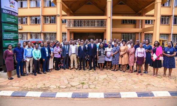 Prof. Buyinza Mukadasi, Mr. Deus Tayari Mujuni, Mr. Yusuf Kiranda and Mr. Amon Muteganda pose for a group photo with new staff during the induction ceremony on 15th May 2025. Makerere University on Thursday 15th May, 2025 embarked on a two-day induction exercise spearheaded by the Directorate of Human Resources for newly appointed staff, whose tenures commenced in the 2024/2025 financial year, Senate Conference Hall, Kampala Uganda, East Africa.