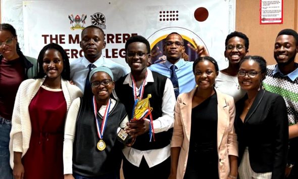 Winners of the Inter-college debates Daphine Kemigisha and Jibiril Ssekandi (School of Law) pose for a photo with debaters and the GRCs of the Debate Union. Organised by the Makerere Debating Union – a student-led initiative, the Inter-college Debate Tournament was held on 11th and 12th April 2025 with a vision to leave no student behind by nurturing a community of confident, articulate, and visionary leaders who will drive positive change in society. Makerere University, Kampala Uganda, East Africa.