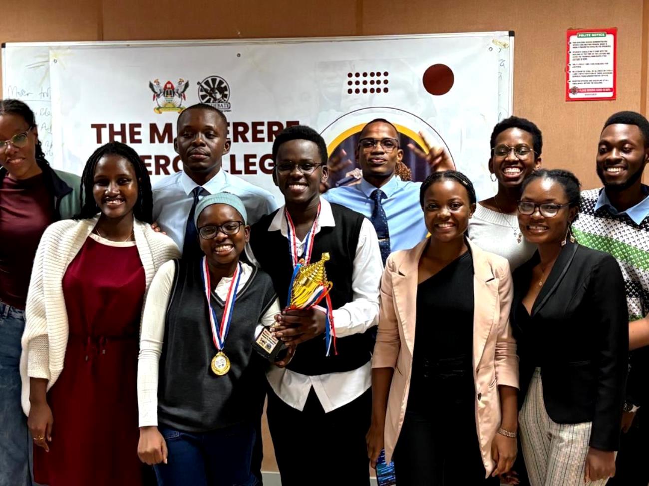 Winners of the Inter-college debates Daphine Kemigisha and Jibiril Ssekandi (School of Law) pose for a photo with debaters and the GRCs of the Debate Union. Organised by the Makerere Debating Union – a student-led initiative, the Inter-college Debate Tournament was held on 11th and 12th April 2025 with a vision to leave no student behind by nurturing a community of confident, articulate, and visionary leaders who will drive positive change in society. Makerere University, Kampala Uganda, East Africa.