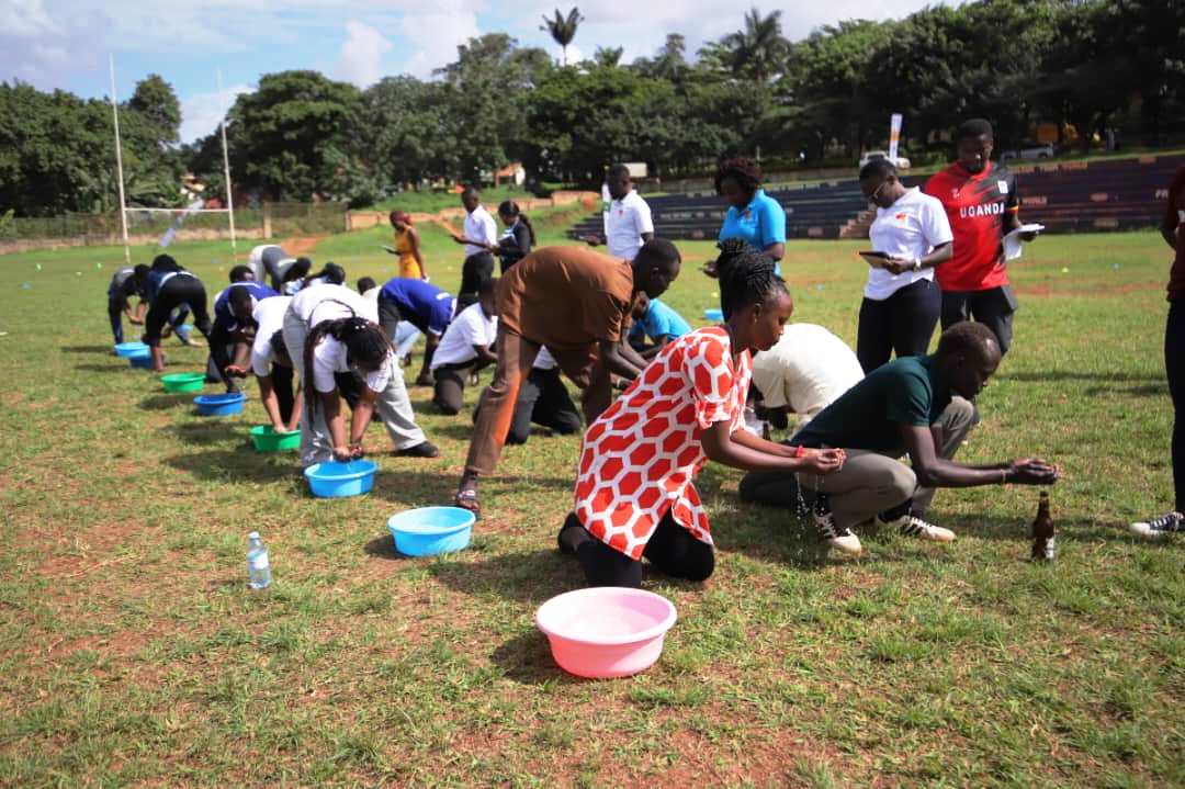 Bottle filling was part of the fun and games. Mastercard Foundation Scholars Program family day event, 19th May 2025, Rugby Grounds, Makerere University, Kampala Uganda, East Africa.