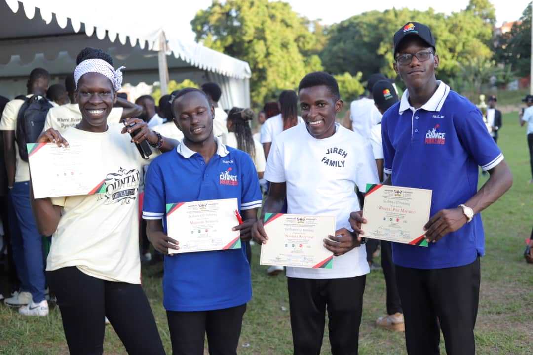 Scholars show off their certificates. Mastercard Foundation Scholars Program family day event, 19th May 2025, Rugby Grounds, Makerere University, Kampala Uganda, East Africa.