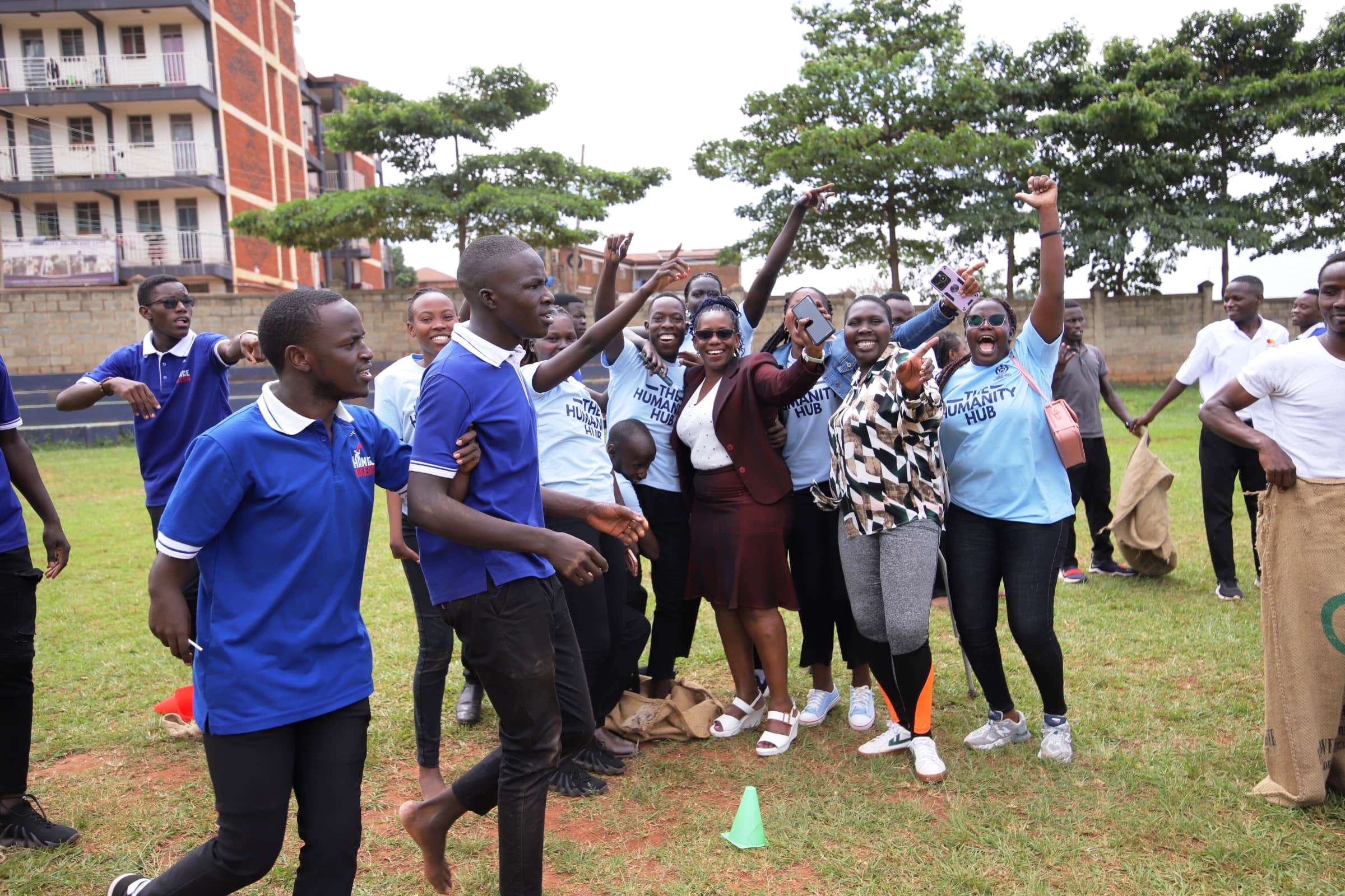 Prof. Justine Namaalwa enjoys a fun moment with teams that took part in the sack race. Mastercard Foundation Scholars Program family day event, 19th May 2025, Rugby Grounds, Makerere University, Kampala Uganda, East Africa.