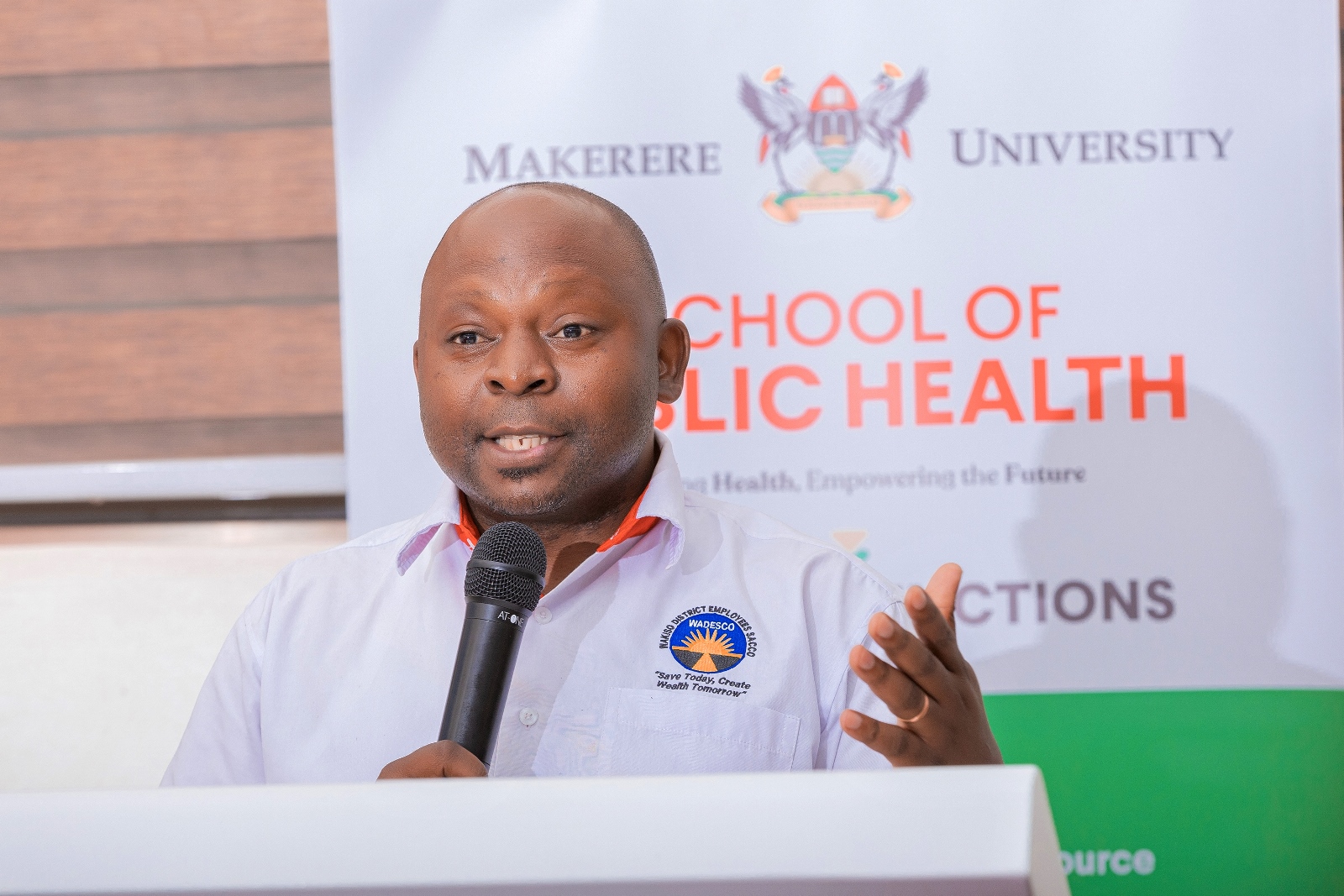 Mr. Kakande speaking during the dissemination event at Makerere University School of Public Health on April 23, 2025. Makerere University School of Public Health (MakSPH) disseminating outcomes of a major leadership and management strengthening initiative in Wakiso District, Central Uganda. The one-year project, part of the Global Health Partnerships programme funded by NHS England implemented in collaboration with Nottingham Trent University, Nottingham University Hospitals NHS Trust, Wakiso District Local Government, and Uganda’s Ministry of Health, 23rd April 2025, MakSPH Auditorium, Kampala, East Africa.