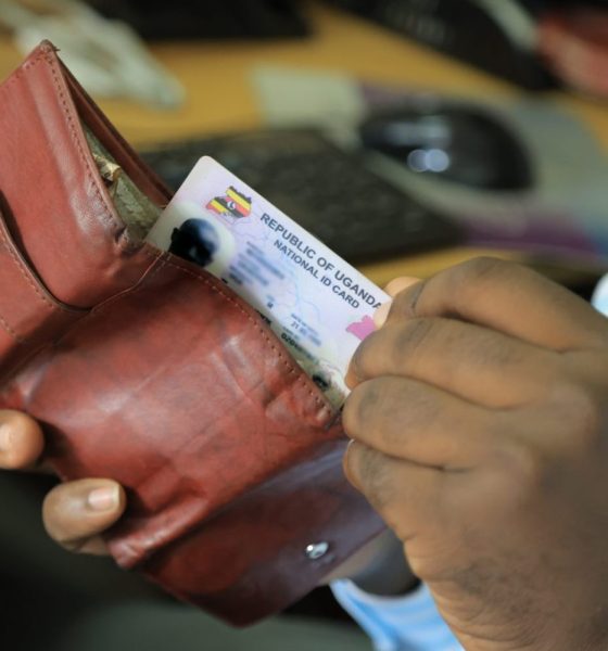 A man reaches for the Uganda National ID from his wallet. New study, “Understanding the Benefits, Costs, and Challenges of the National Identification System in Uganda,” published in Digital Society, for every US$1 invested in the NID system, the return on investment is US$1.35, led by Roy William Mayega from Makerere University School of Public Health’s Resilient Africa Network (MakSPH-RAN), Kampala, Uganda, East Africa.