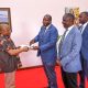 Prof. Omotade Akin Aina (Left) receives the Makerere Souvenir Book from Prof. Tonny Oyana as Prof. Julius Kikooma (2nd Right) and Mr. Charles Lwanga (Right) witness. Prof. Omotade Akin Aina-Carnegie Corporation of New York meeting to discuss progress of Consolidating Early Career Academics Programme (CECAP) phase II, which focuses on fostering academic development and research among early-career academics, 23rd May 2025, Main Building, Makerere University, Kampala Uganda, East Africa.