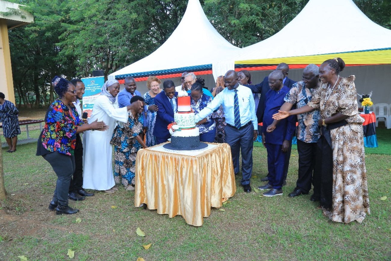 CAES staff led by the DVCAA and the Principal cutting cake in celebration of the achievements. College of Agricultural and Environmental Sciences (CAES) refurbishment of Makerere University Agricultural Research Institute Kabanyolo (MUARIK) Main Gate by students from both CAES and the College of Engineering, Design, Art, and Technology (CEDAT), official opening, 30th May 2025, Wakiso Uganda, East Africa.