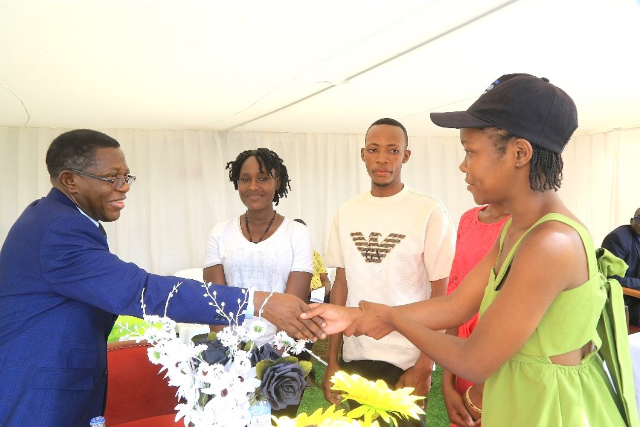 Prof. Buyinza Mukadasi appreciating some of the students who did the refurbishment. College of Agricultural and Environmental Sciences (CAES) refurbishment of Makerere University Agricultural Research Institute Kabanyolo (MUARIK) Main Gate by students from both CAES and the College of Engineering, Design, Art, and Technology (CEDAT), official opening, 30th May 2025, Wakiso Uganda, East Africa.