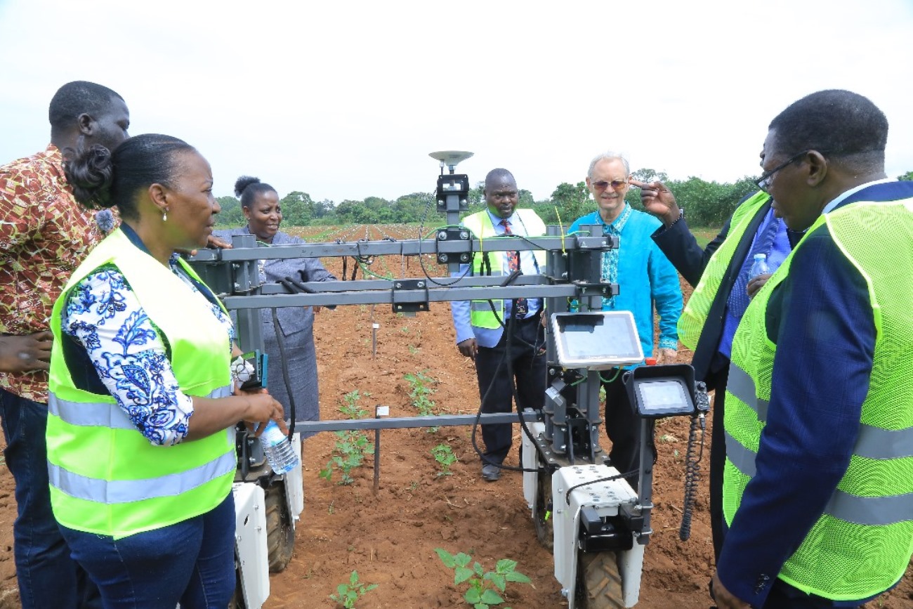 Prof. Richard Edema explaining to the team how the Rover operates, highlighting its key components, functionality, and the technology behind its movement and data collection capabilities. College of Agricultural and Environmental Sciences (CAES) refurbishment of Makerere University Agricultural Research Institute Kabanyolo (MUARIK) Main Gate by students from both CAES and the College of Engineering, Design, Art, and Technology (CEDAT), official opening, 30th May 2025, Wakiso Uganda, East Africa.