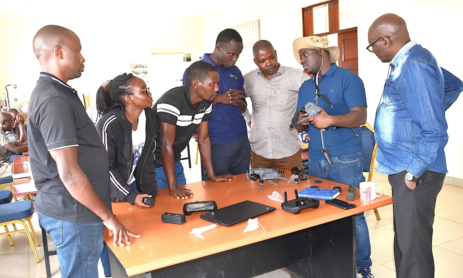 Mr. Timothy Mutungi, a certified Remote Sensing Drone Pilot, training the project team in drone operations. At Makerere, the project is coordinated by Dr Alex Nimusiima, third right. Nature-based Solutions for Tea (NbS4Tea) project at College of Agricultural and Environmental Sciences (CAES), Makerere University, Kampala, Funded by the Danish Fellowship Centre under Denmark’s Ministry of Foreign Affairs, deployment of drones to improve environmental and agricultural data collection at Rwebitaba Tea Research Centre in Kyenjojo District, Uganda, East Africa, 19th June 2025.