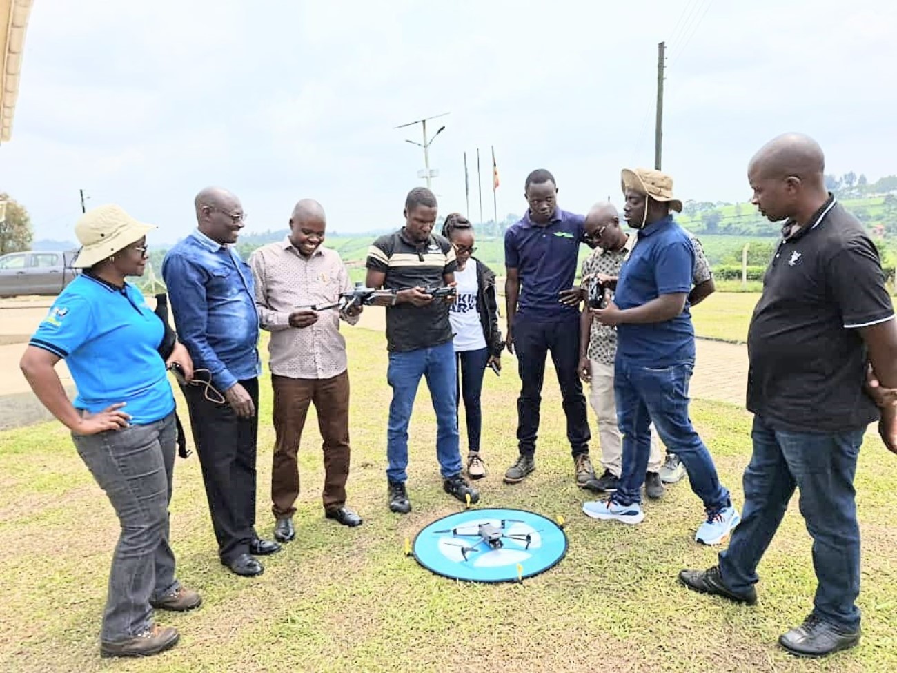 The project team being trained on drone operation. Nature-based Solutions for Tea (NbS4Tea) project at College of Agricultural and Environmental Sciences (CAES), Makerere University, Kampala, Funded by the Danish Fellowship Centre under Denmark’s Ministry of Foreign Affairs, deployment of drones to improve environmental and agricultural data collection at Rwebitaba Tea Research Centre in Kyenjojo District, Uganda, East Africa, 19th June 2025.