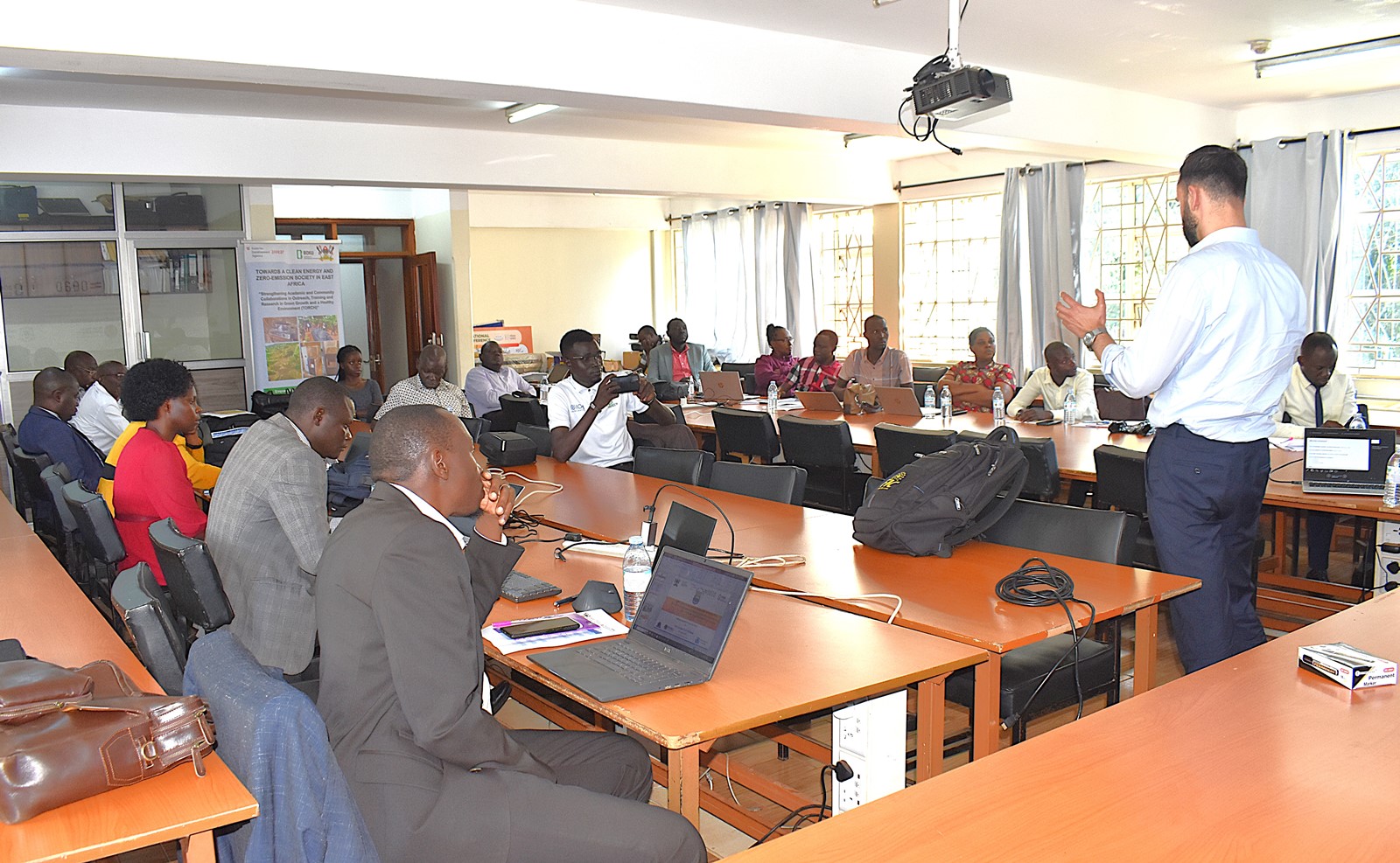 Mr. Andreas Bauer delivering his presentation on the significance of living labs. Department of Soil Science and Land Use Management at the College of Agricultural and Environmental Sciences (CAES), launch of two-year project, code-named TORCH (Towards a Clean Energy and Zero-emission Society in East Africa) to foster green growth and promoting sustainable development across East Africa, June 2025, GIS Lab, College of Computing and Information Sciences (CoCIS) Makerere University, Kampala Uganda.