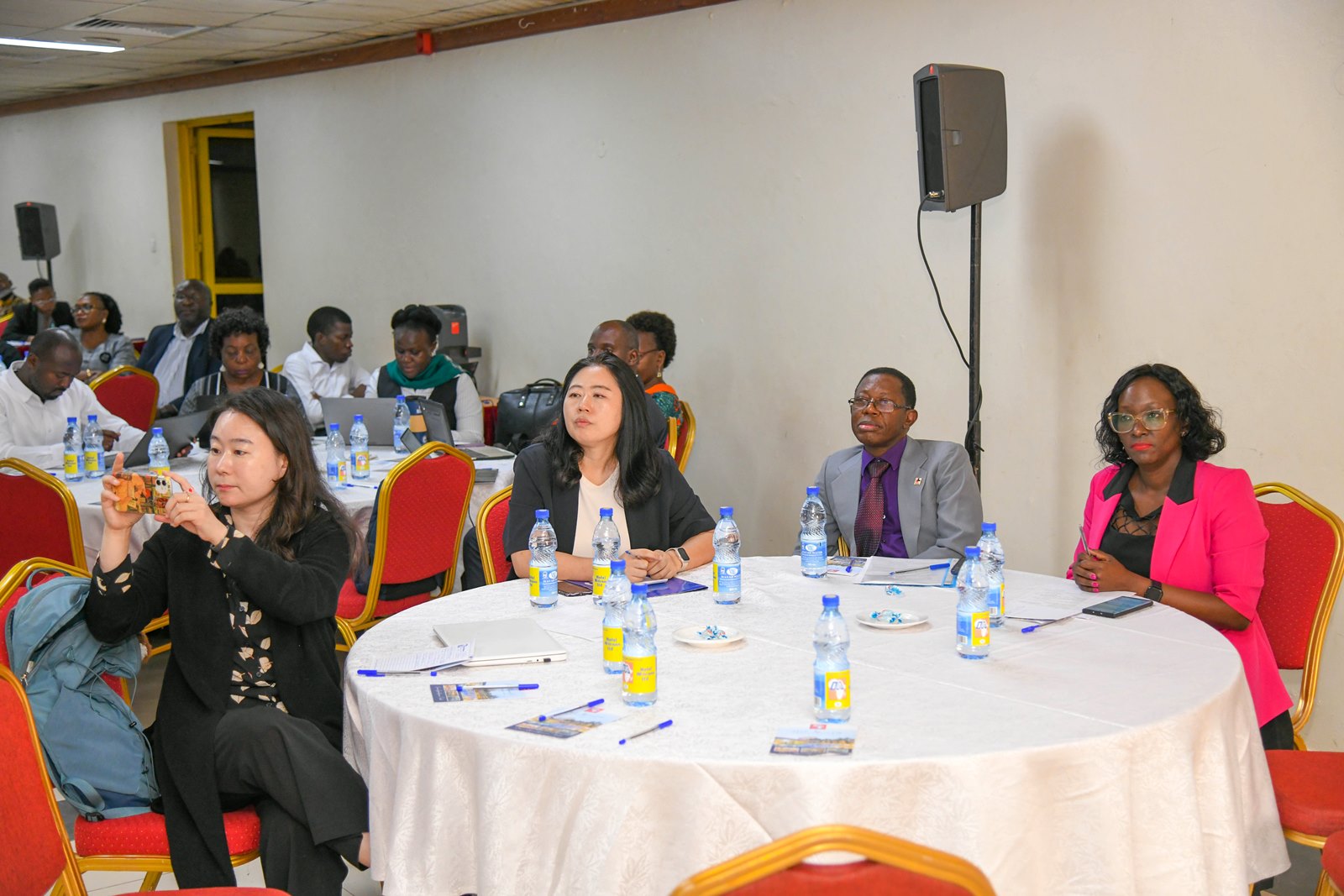 Prof. Buyinza Mukadasi, Ms. Ahn Jihee and part of the audience at the event. Unveiling and stakeholder review of Draft Master Plan for Open, Distance, and e-Learning (ODeL), funded by KOICA and implemented with technical support from the Korea National Open University (KNOU) and the Korea Institute for Development Strategy (KDS), 5th June 2025, Hotel Africana, Kampala Uganda, East Africa.