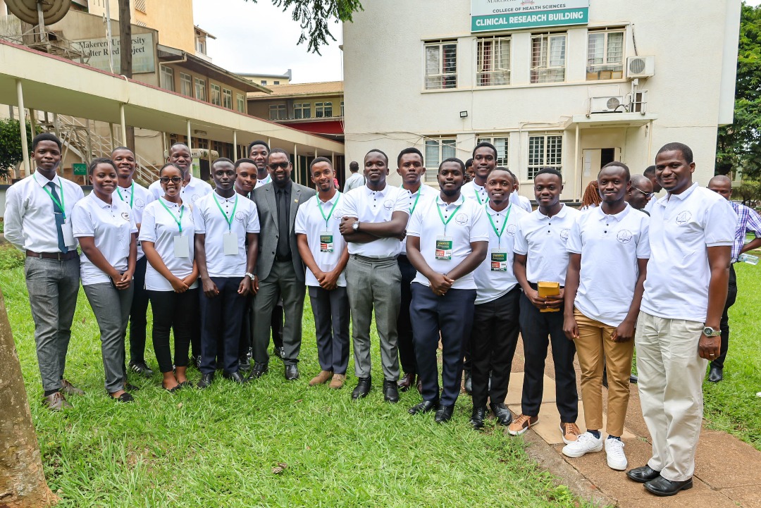 Students with Principal in black suit and Prof. Mwaka Erisa_HoD Anatomy first right. Makerere University College of Health Sciences (MakCHS) commemorated the silent teacher-cadavers used in anatomy classes for medical students, created awareness and sensitised the public about importance of whole body donation, 30th May 2025, New Mulago Hospital Complex, Kampala Uganda, East Africa.