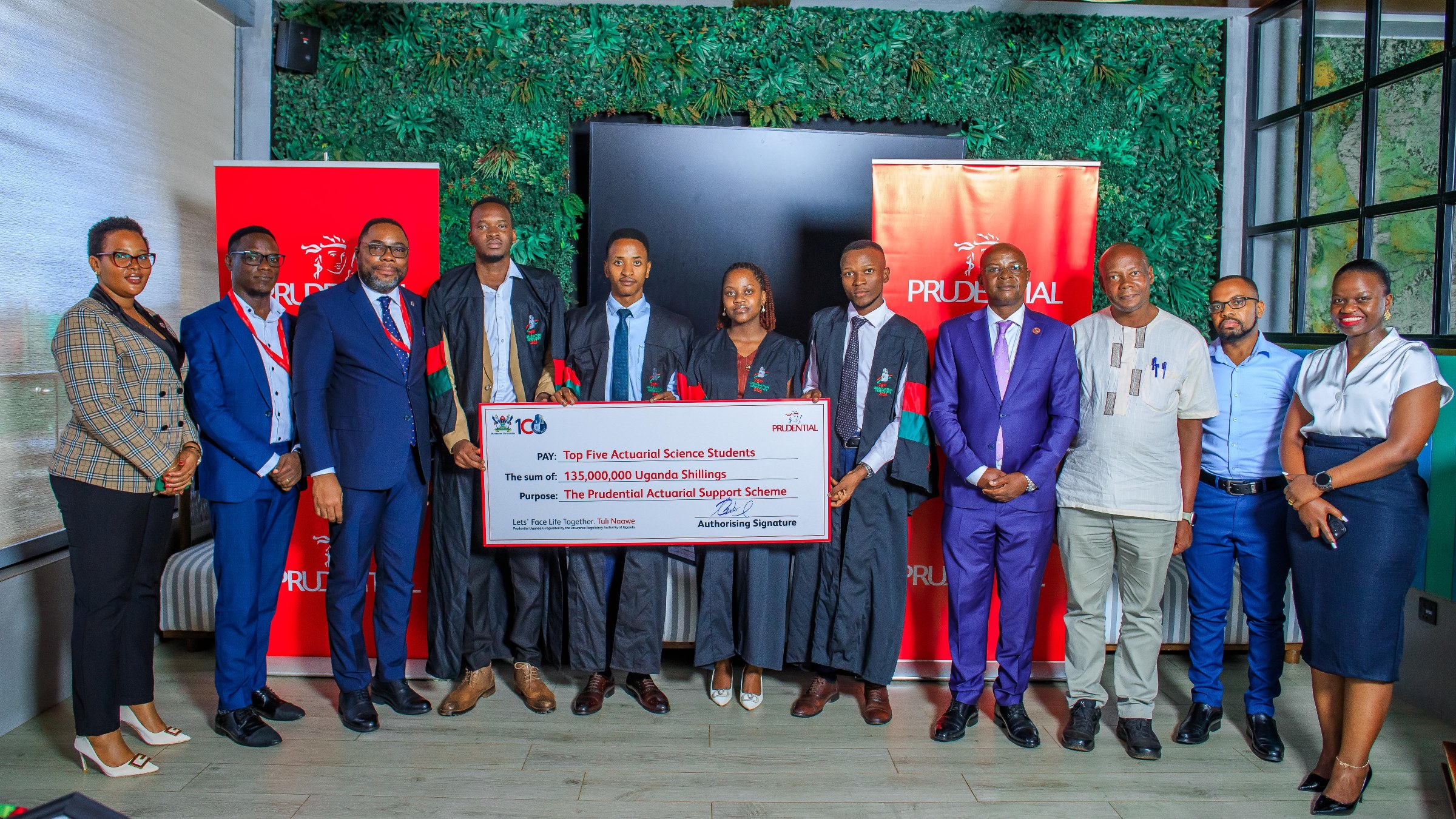 Mr. Tetteh Ayitevie (3rd L), Prof. Edward Bbaale (4th R), Dr. Felix Wamono (3rd R) and officials pose for a group photo with four of the Top Five Actuarial Science Students of the 75th Graduation Ceremony on 11th June 2025. Prudential Uganda award of UGX 135 million to the top five graduates of Makerere University’s Actuarial Science program, under the Prudential Actuarial Support Scheme (PASS), demonstrating its firm commitment to nurturing globally competitive actuarial talent within the country, 11th June 2025, Kampala Uganda, East Africa.