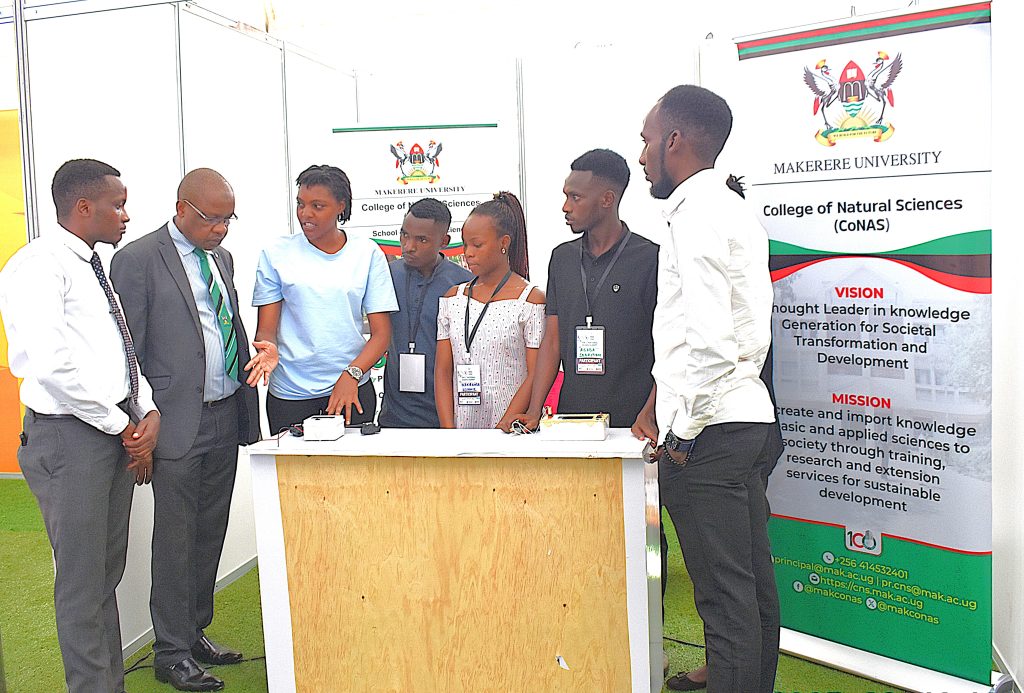 Students showcasing their product aimed at detecting harmful aflatoxins in food. Over 300 Ugandan innovators, among them students from the College of Natural Sciences (CoNAS) and other science-based colleges at Makerere University are participating in the 2025 National Science Week exhibition, currently underway at the Kololo Independence Grounds, 15th-20th June 2025, Kampala Uganda, East Africa.