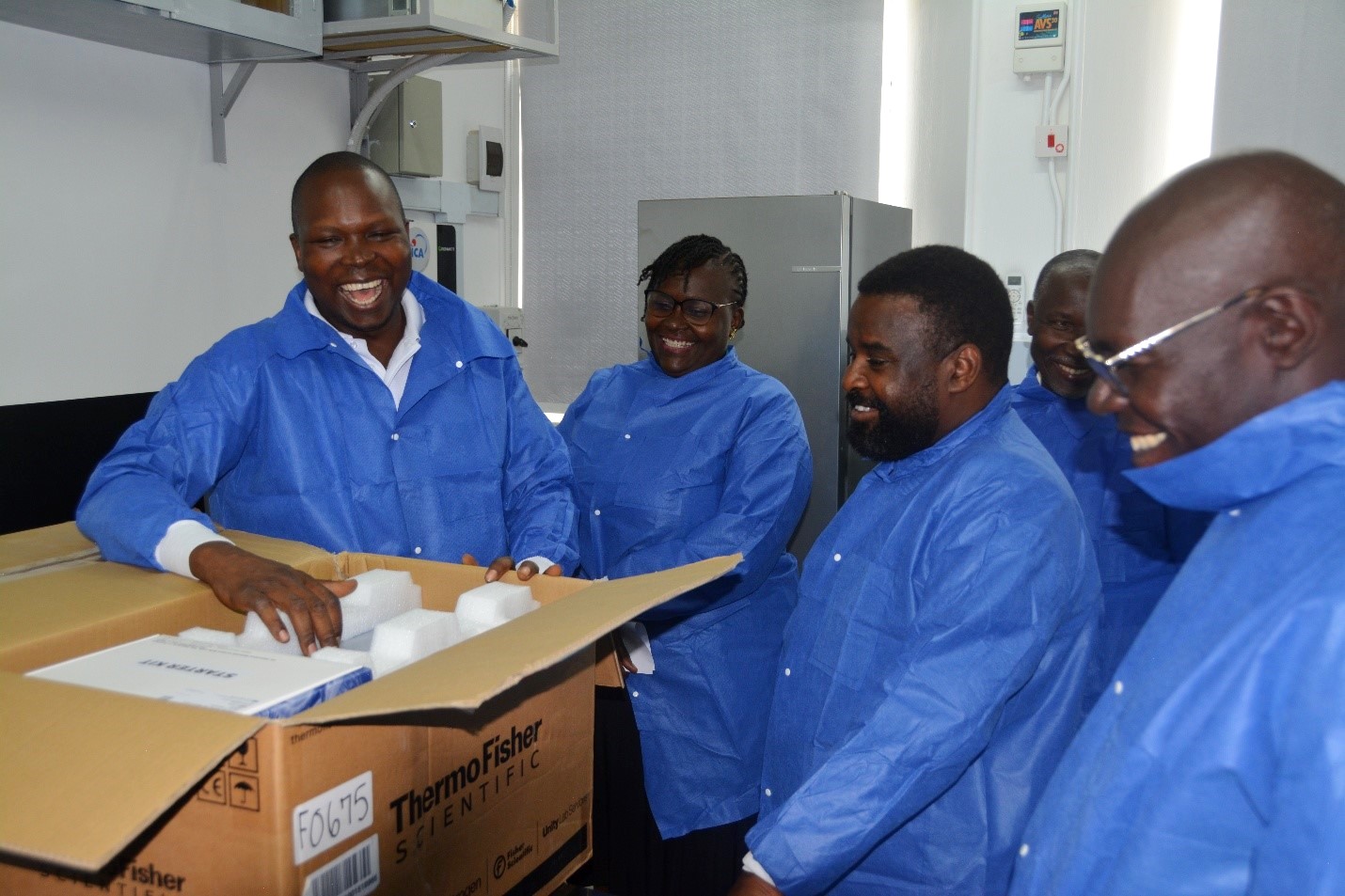 Dr. Patrick Vudrico (L) led the team on a guided tour of the equipment in the RTC Lab. Donation of scientific laboratory equipment worth USD 400,000 (Shs. 1.4 billion) through the Seeding Labs’ Instrumental Access Program to enhance teaching, research, and diagnostic services at the College of Veterinary Medicine, Animal Resources and Biosecurity (CoVAB), 4th June 2025, Makerere University, Kampala Uganda, East Africa.