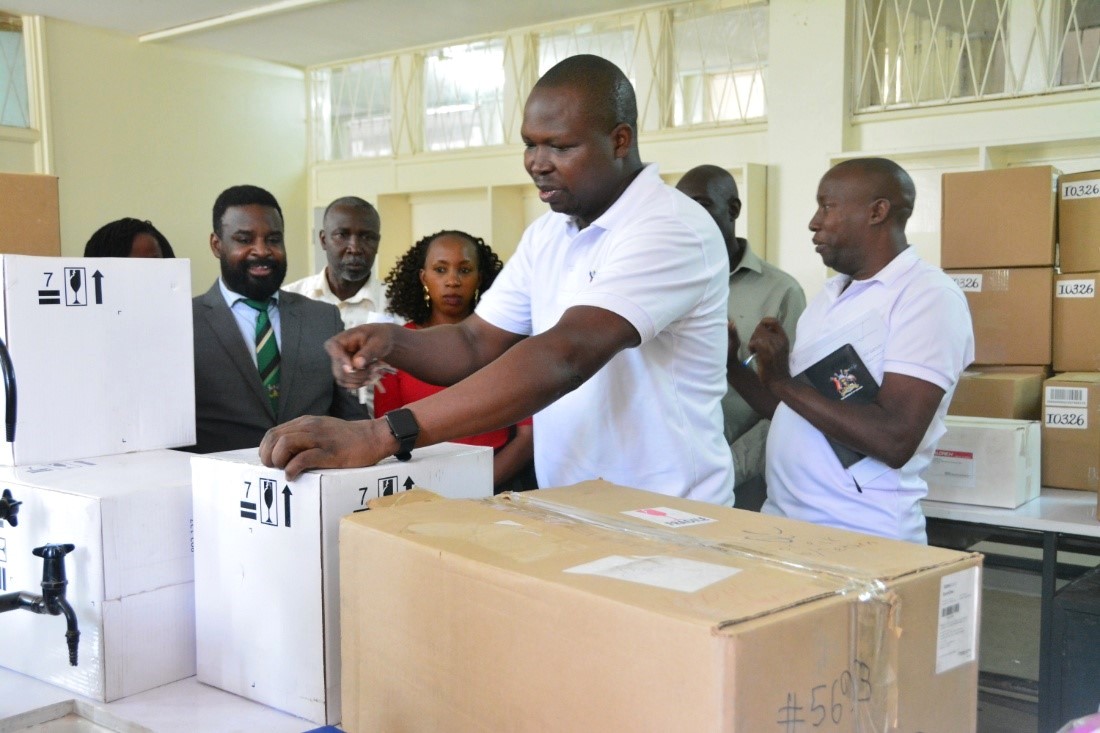 Dr. Patrick Vudrico opening some of the cartons to check out equipment. Donation of scientific laboratory equipment worth USD 400,000 (Shs. 1.4 billion) through the Seeding Labs’ Instrumental Access Program to enhance teaching, research, and diagnostic services at the College of Veterinary Medicine, Animal Resources and Biosecurity (CoVAB), 4th June 2025, Makerere University, Kampala Uganda, East Africa.