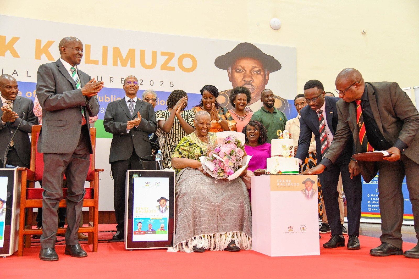 A surprise 90th Birthday celebration for Mrs. Esther Kalimuzo at the event. 2nd Frank Kalimuzo Memorial Lecture, theme ‘Building a culture of service in Public Institutions’ organised in partnership with Makerere University Business School (MUBS), 13th June 2025, Main Hall, Makerere University, Kampala Uganda, East Africa.