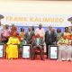 Seated L-R: Mrs. Allen Kagina, Prof. Moses Muhwezi, Mrs. Esther Kallimuzo and her daughter with dignitaries and family at the 2nd Frank Kalimuzo on 13th June 2025. 2nd Frank Kalimuzo Memorial Lecture, theme ‘Building a culture of service in Public Institutions’ organised in partnership with Makerere University Business School (MUBS), 13th June 2025, Main Hall, Makerere University, Kampala Uganda, East Africa.