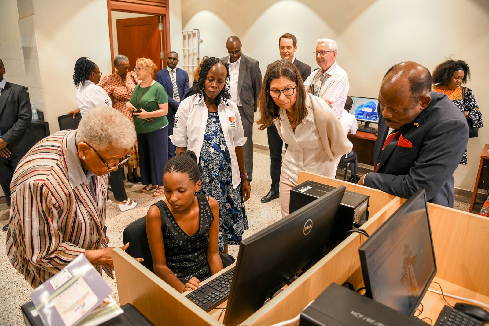 H.E. Ellen Johnson and other Board Members interact with a student during a visit to the Disability Support Centre. Mastercard Foundation Board Inaugural visit to Makerere University led by H.E. Ellen Johnson Sirleaf, former President of Liberia, 17th June 2025, Kampala Uganda, East Africa.