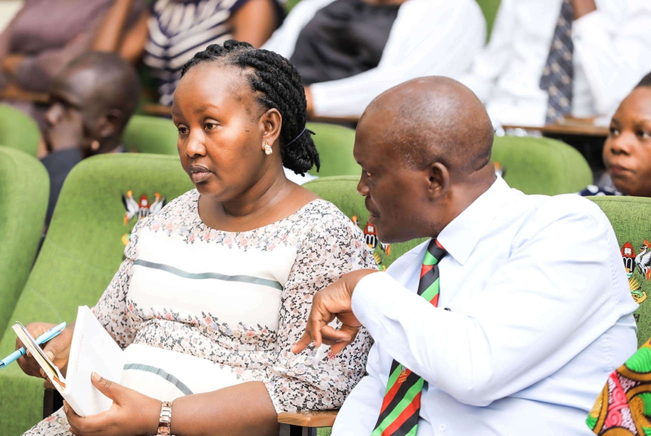 MakSPH’s Assoc. Prof. Fredrick Makumbi, the Principal Investigator for UPHIA 2025 survey, consults with MoH’s Commissioner for Human Resource Management, Ms. Annet Musinguzi, during the kick-off of training of UPHIA 2025 field teams at MakSPH New Auditorium on 19th May, 2025. Kickoff training for teams tasked with collecting data for the Uganda Population-Based HIV Impact Assessment (UPHIA) 2024-2025, held 19th May 2025, Makerere University School of Public Health (MakSPH) Auditorium, Main Campus, Kampala Uganda, East Africa.