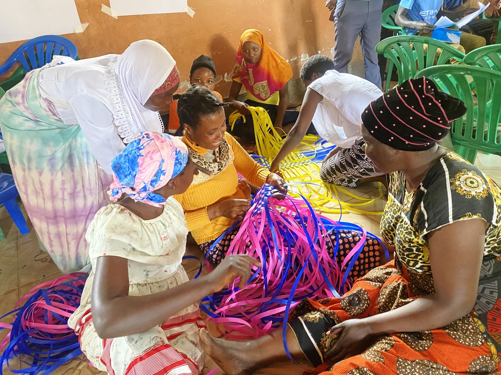Some of the refugee young women being trained on how to make traditional mats, courtesy of 'A hand for a Refugee' project. Mastercard Foundation Scholars Program at Makerere University, International World Refugee Day 2025, themed “solidarity with refugees,” highlights of remarkable achievements of Scholars and alumni with refugee backgrounds, June 2025, Kampala Uganda, East Africa.