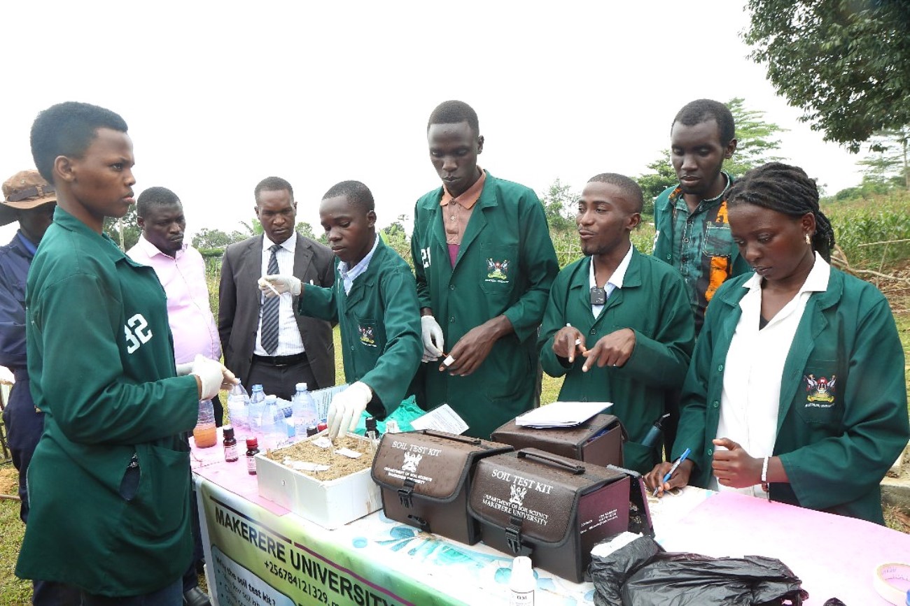 Interns attached to Masaka District testing soil samples during the Field Day activities held on 23rd July 2025 at Green Valley Farm. College of Agricultural and Environmental Sciences (CAES) at Makerere University, Kampala Uganda, East Africa revitalization of internship programme for 51 students at Mbulamu Integrated Farm, Mpigi District and Green Valley Farm, Masaka District. Coordinators: Dr. Emmanuel Opolot, Dr. Gabriel Karubanga.