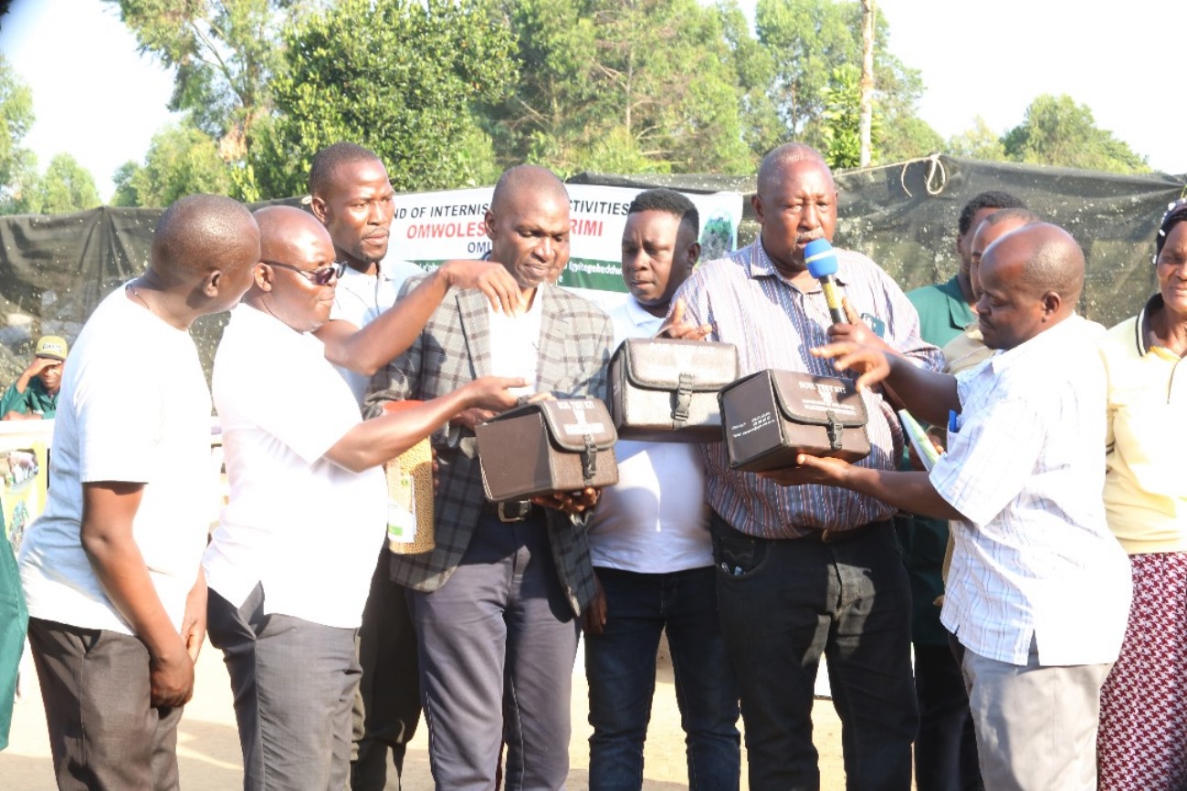 Dr. Richard Miiro handing over soil test kits to Masaka DPMO, Mr. Ssekayi Godfrey during the Field Day activities at Green Valley Farm. College of Agricultural and Environmental Sciences (CAES) at Makerere University, Kampala Uganda, East Africa revitalization of internship programme for 51 students at Mbulamu Integrated Farm, Mpigi District and Green Valley Farm, Masaka District. Coordinators: Dr. Emmanuel Opolot, Dr. Gabriel Karubanga.