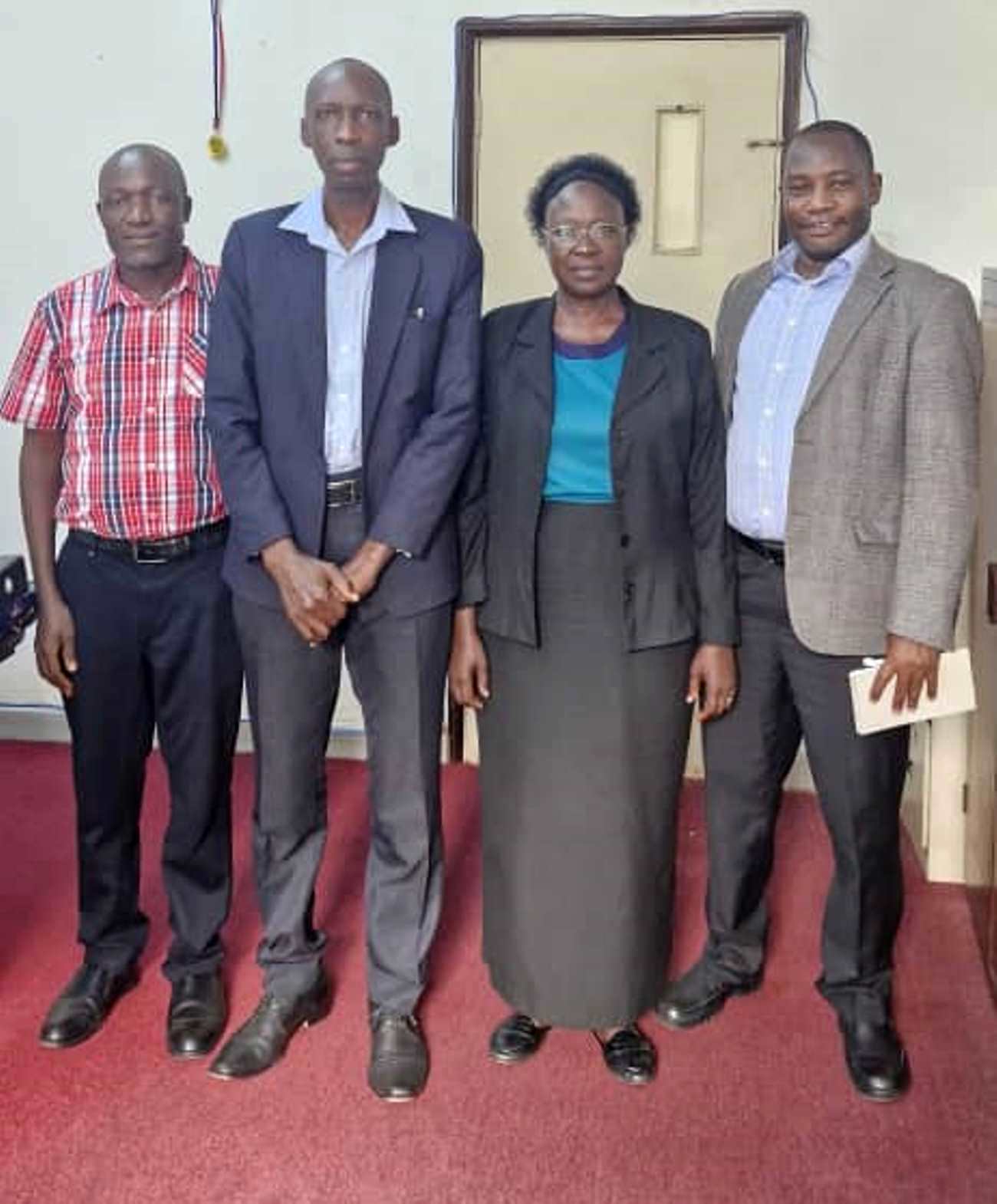 Left to Right: Dr. Alfred Buluma, Prof. Anthony Muwagga Mugagga (Principal), Associate Professor Josephine Esaete (Principal Investigator), and Dr. Michael Walimbwa in the Principal's Office on 24th July 2025. Team behind 1 million Euros grant to support the implementation of a research titled, Transitioning Higher Education Regulators and Universities to Competence Based Education in East and West Africa meeting Principal, College of Education and External Studies (CEES), 24th July 2025, Makerere University, Kampala Uganda, East Africa.