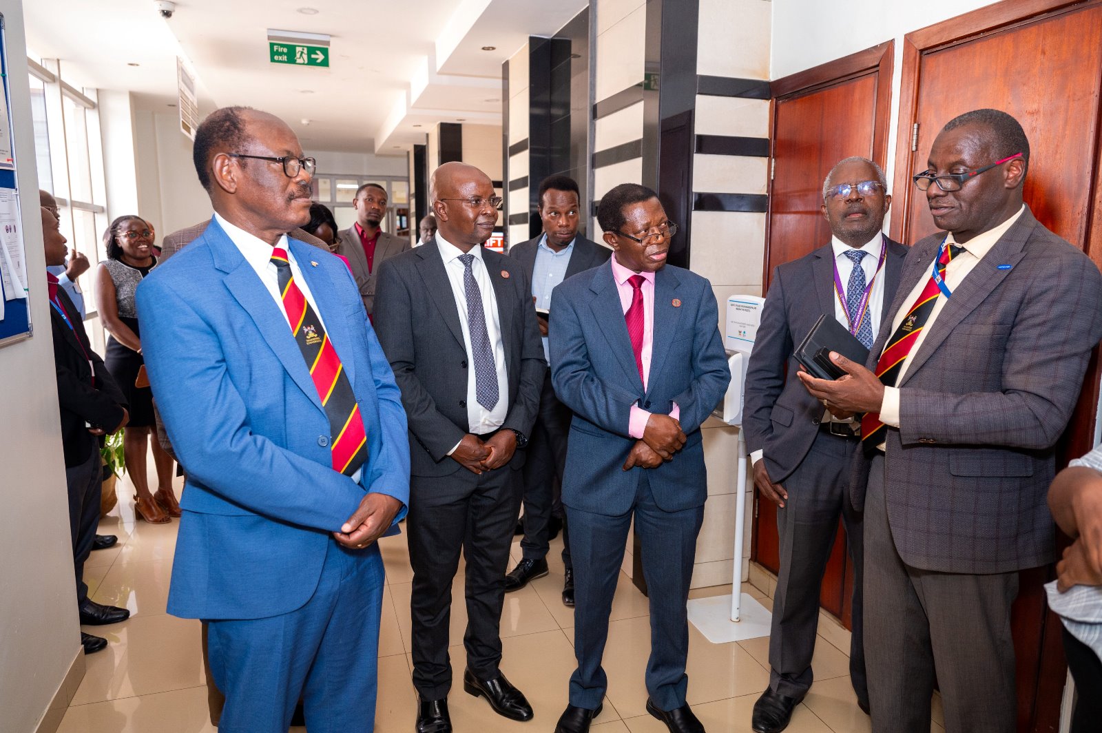 Left to Right: Prof. Barnabas Nawangwe, Prof. Edward Bbaale, Prof. Buyinza Mukadasi, Prof. Sam Luboga and Dr. Andrew Kambugu chat during a tour of the facility. Vice Chancellor, Prof. Barnabas Nawangwe inaugurated the Infectious Diseases Institute (IDI) at Makerere University's ground-breaking 384kWp solar-powered electricity grid, Africa’s largest campus-based solar system, July 24, 2024, Kampala Uganda, East Africa.