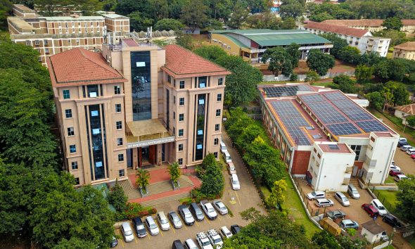 An elevated shot of the IDI-McKinnell Knowledge Centre (Left) and the Department of Pharmacy Building (Right) with the array of solar panels. Vice Chancellor, Prof. Barnabas Nawangwe inaugurated the Infectious Diseases Institute (IDI) at Makerere University's ground-breaking 384kWp solar-powered electricity grid, Africa’s largest campus-based solar system, July 24, 2024, Kampala Uganda, East Africa.