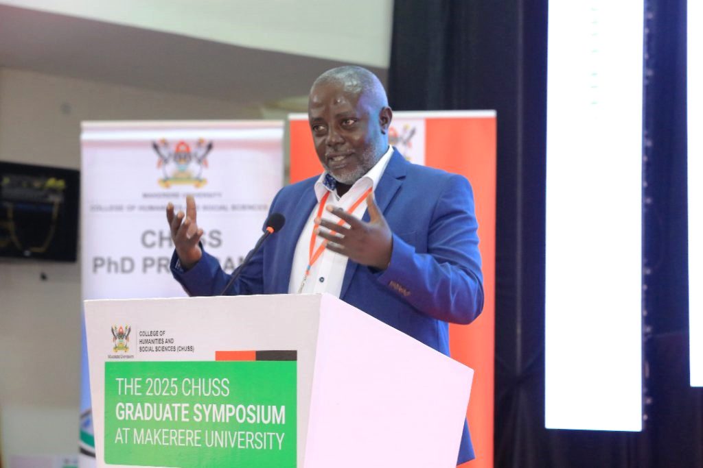 Dr. Edgar Fred Nabutanyi delivers the keynoted address. College of Humanities and Social Sciences (CHUSS) 2025 Graduate Symposium, Day 2, 20th June 2025, Main Hall, Main Building, Makerere University, Kampala Uganda, East Africa.