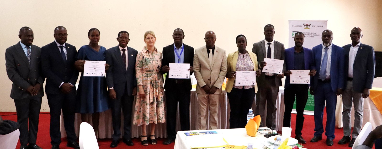 Graduands posing for a group photo with Ambassador Maria Håkansson, Prof. Buyinza Mukadasi and Prof. Edward Bbaale. 4th Cohort of Makerere University Inclusive Green Economy (IGE) Fellows—senior public servants from five key government institutions who completed a year-long training on green economic transformation focusing on reducing emissions in Uganda’s transport sector graduation and introduction of IGE Cohort 2025-2026, Kampala Kolping Hotel, East Africa 2nd July 2025.