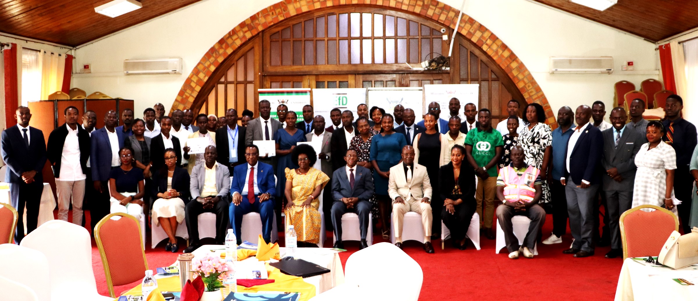 Participants in a group photo with Hon. Dr. Monica Musenero, Prof. Buyinza Mukadasi and other officials after the opening and graduation ceremony on 1st July 2026. 4th Cohort of Makerere University Inclusive Green Economy (IGE) Fellows—senior public servants from five key government institutions who completed a year-long training on green economic transformation focusing on reducing emissions in Uganda’s transport sector graduation and introduction of IGE Cohort 2025-2026, Kampala Kolping Hotel, East Africa 2nd July 2025.