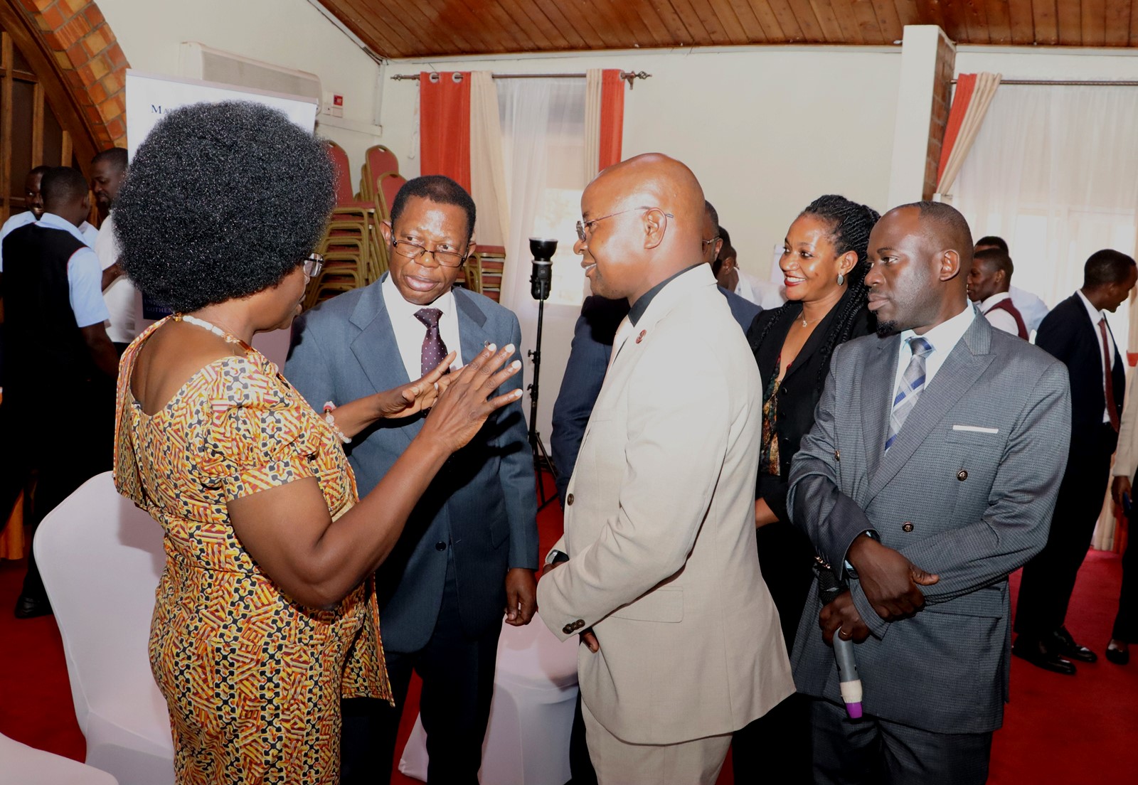 Hon. Dr. Monica Musenero chats with Prof. Buyinza Mukadasi and Prof. Edward Bbaale after the opening session. 4th Cohort of Makerere University Inclusive Green Economy (IGE) Fellows—senior public servants from five key government institutions who completed a year-long training on green economic transformation focusing on reducing emissions in Uganda’s transport sector graduation and introduction of IGE Cohort 2025-2026, Kampala Kolping Hotel, East Africa 2nd July 2025.