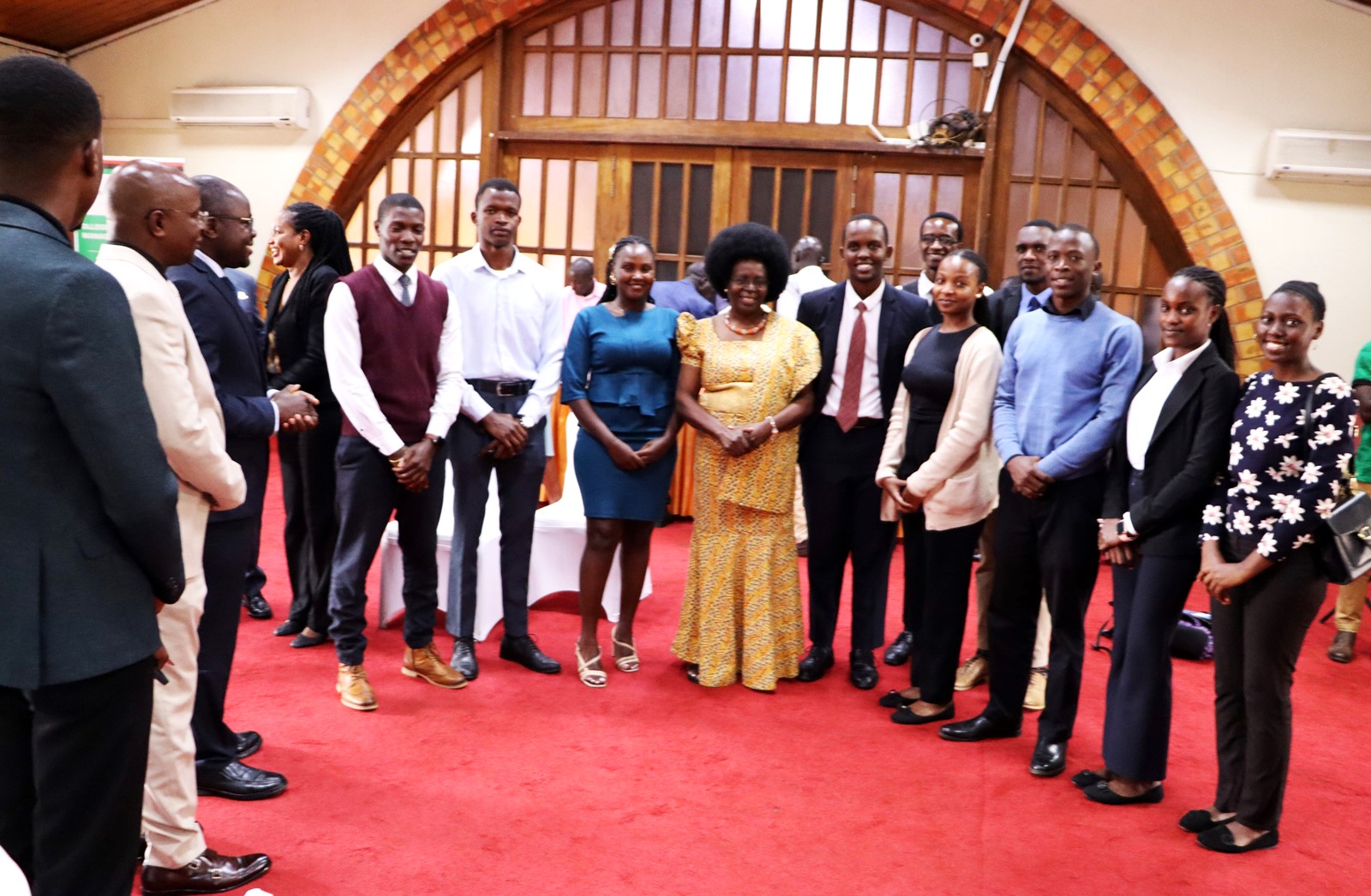 Hon. Dr. Monica Musenero in a group photo with economics students. 4th Cohort of Makerere University Inclusive Green Economy (IGE) Fellows—senior public servants from five key government institutions who completed a year-long training on green economic transformation focusing on reducing emissions in Uganda’s transport sector graduation and introduction of IGE Cohort 2025-2026, Kampala Kolping Hotel, East Africa 2nd July 2025.