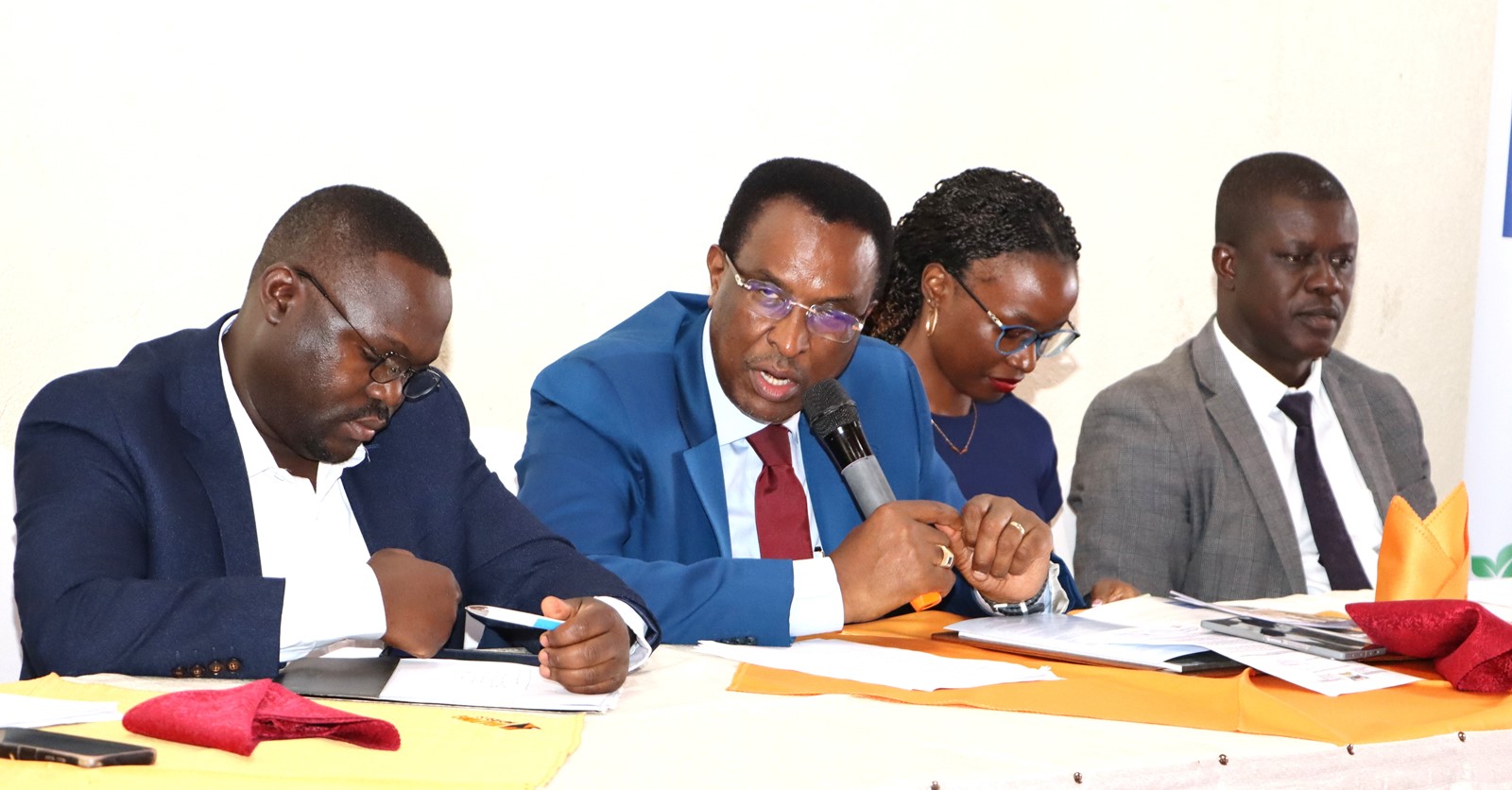 A section of panelists discussing. 4th Cohort of Makerere University Inclusive Green Economy (IGE) Fellows—senior public servants from five key government institutions who completed a year-long training on green economic transformation focusing on reducing emissions in Uganda’s transport sector graduation and introduction of IGE Cohort 2025-2026, Kampala Kolping Hotel, East Africa 2nd July 2025.