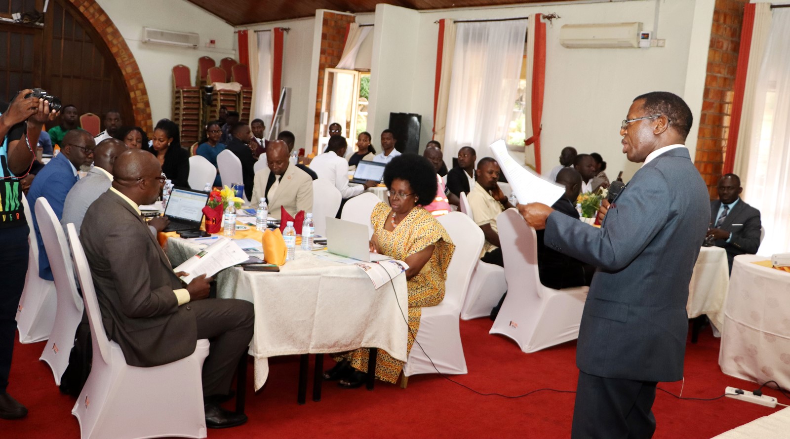Prof. Buyinza Mukadasi speaking. 4th Cohort of Makerere University Inclusive Green Economy (IGE) Fellows—senior public servants from five key government institutions who completed a year-long training on green economic transformation focusing on reducing emissions in Uganda’s transport sector graduation and introduction of IGE Cohort 2025-2026, Kampala Kolping Hotel, East Africa 2nd July 2025.