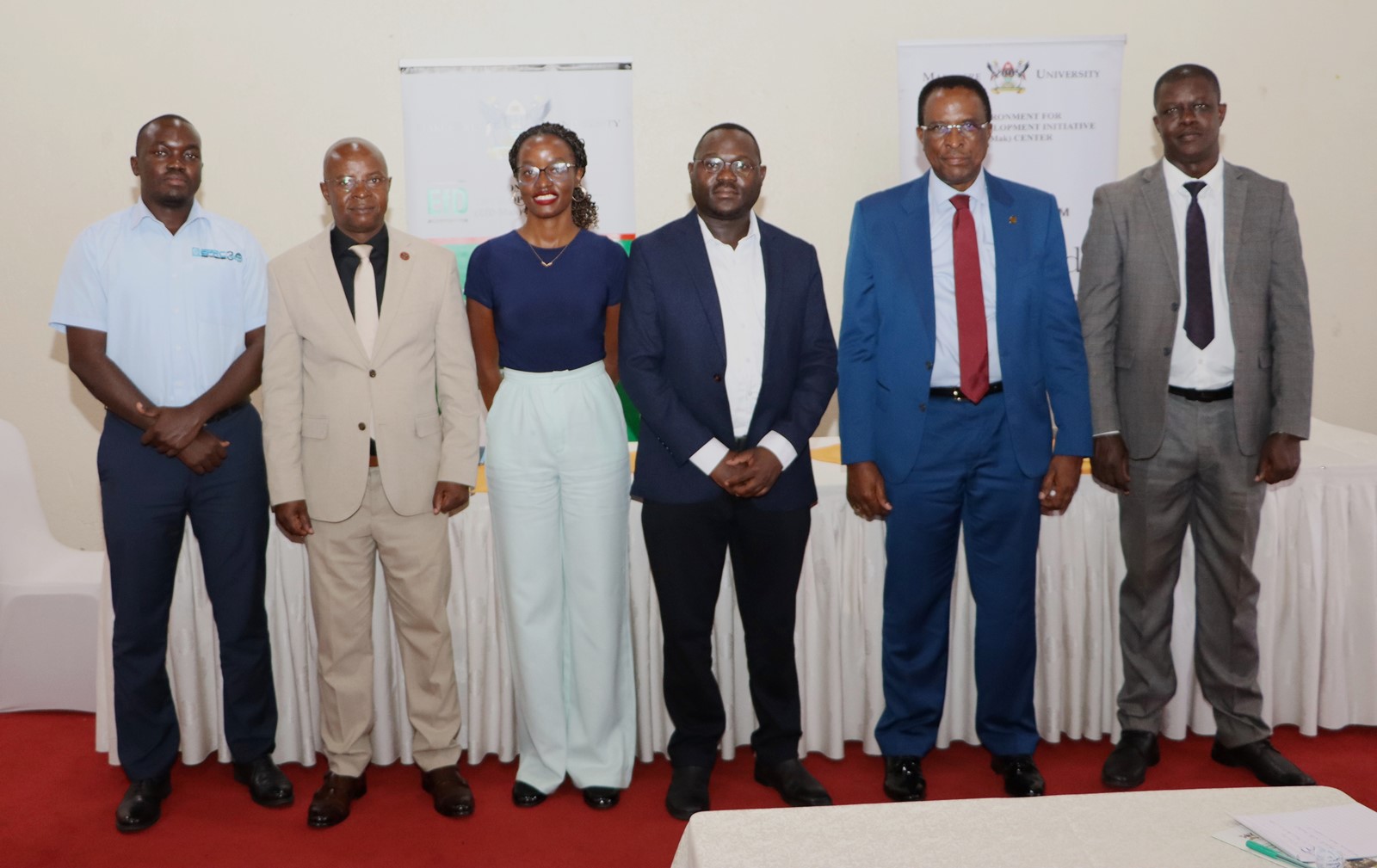 Prof. Edward Bbaale (2nd L) with the panelists after the discussion. 4th Cohort of Makerere University Inclusive Green Economy (IGE) Fellows—senior public servants from five key government institutions who completed a year-long training on green economic transformation focusing on reducing emissions in Uganda’s transport sector graduation and introduction of IGE Cohort 2025-2026, Kampala Kolping Hotel, East Africa 2nd July 2025.